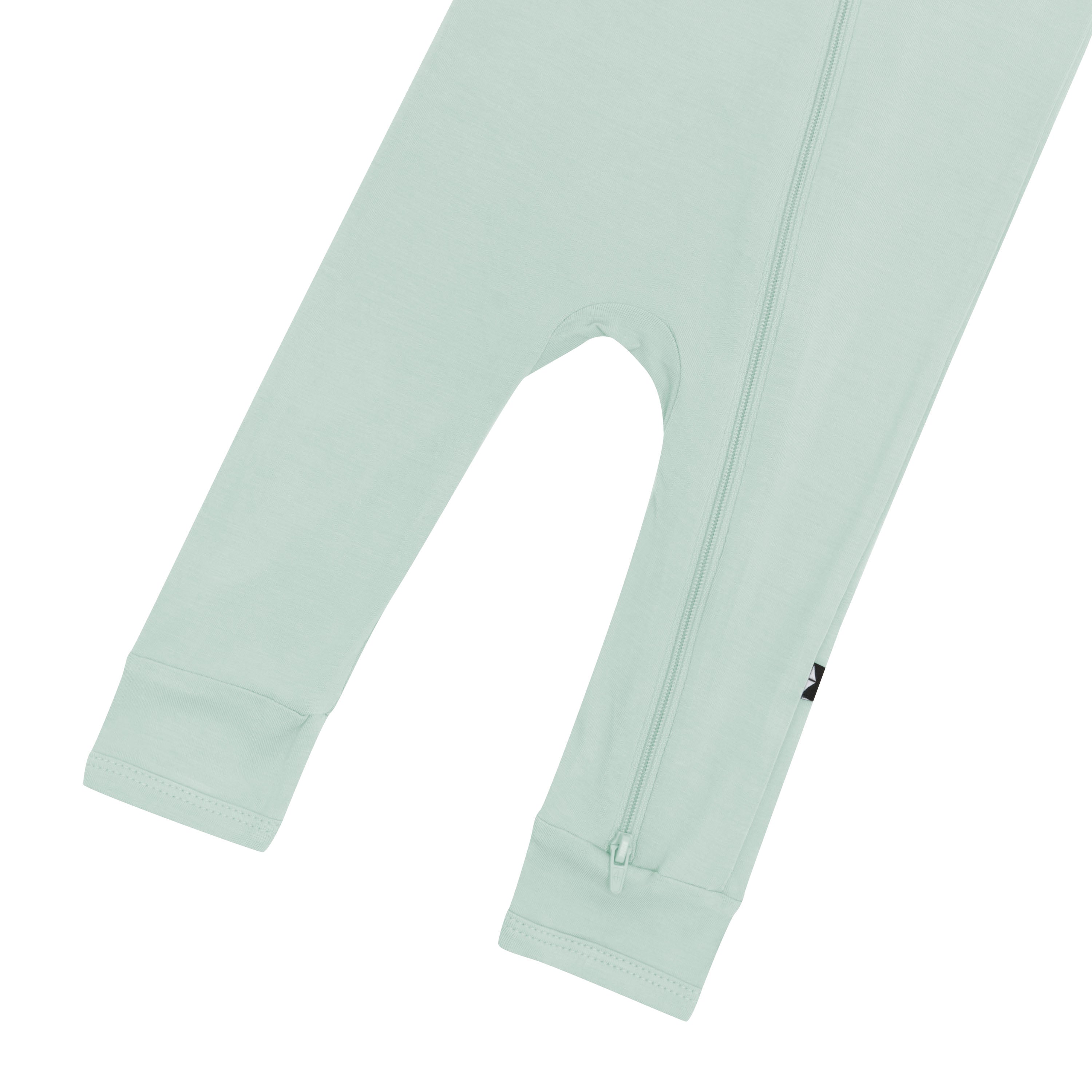 Close up of legs and bottom zipper on the Kyte Baby Zippered Romper in Sage