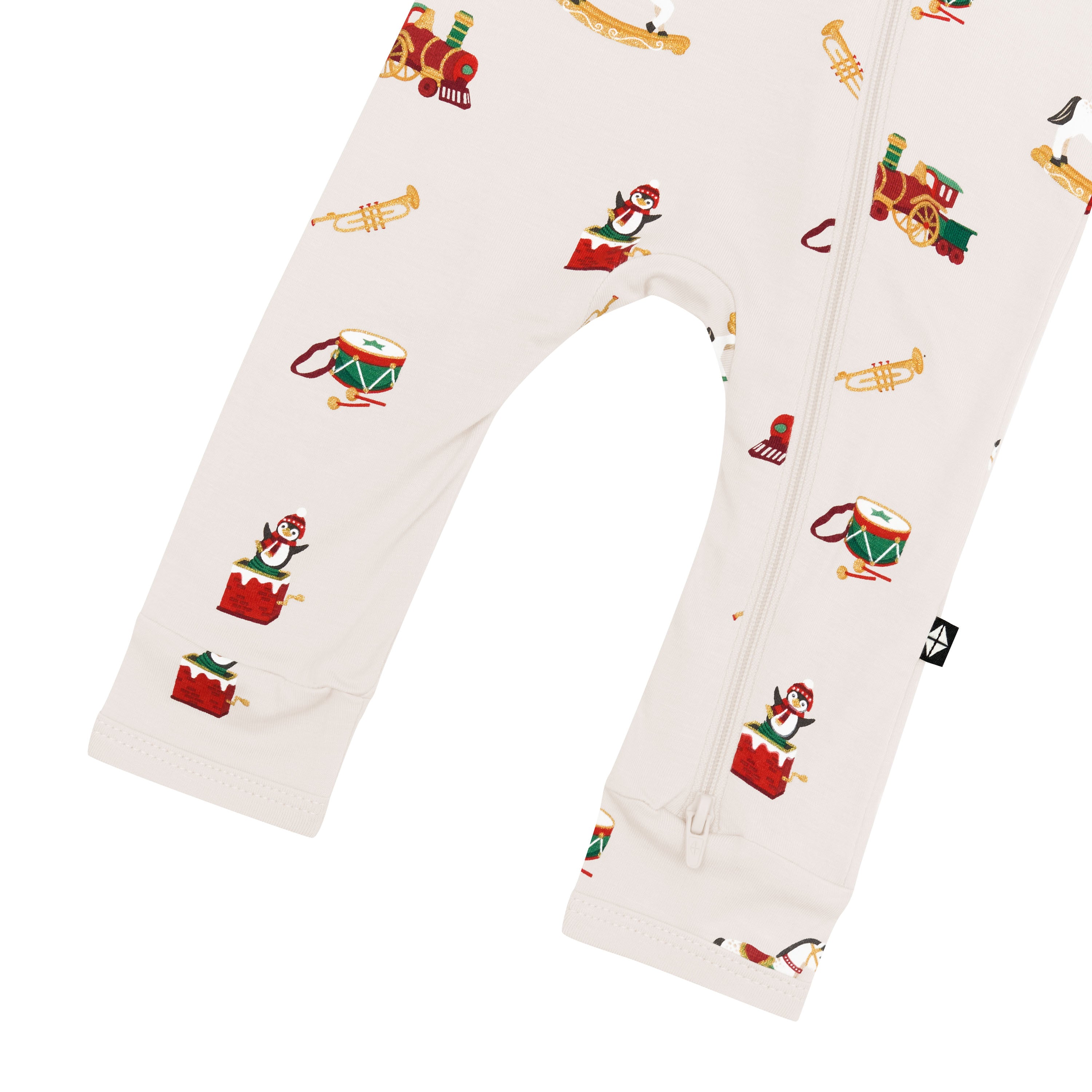 Bottom zipper closure shown on the leg of the Zippered Romper in Vintage Toys