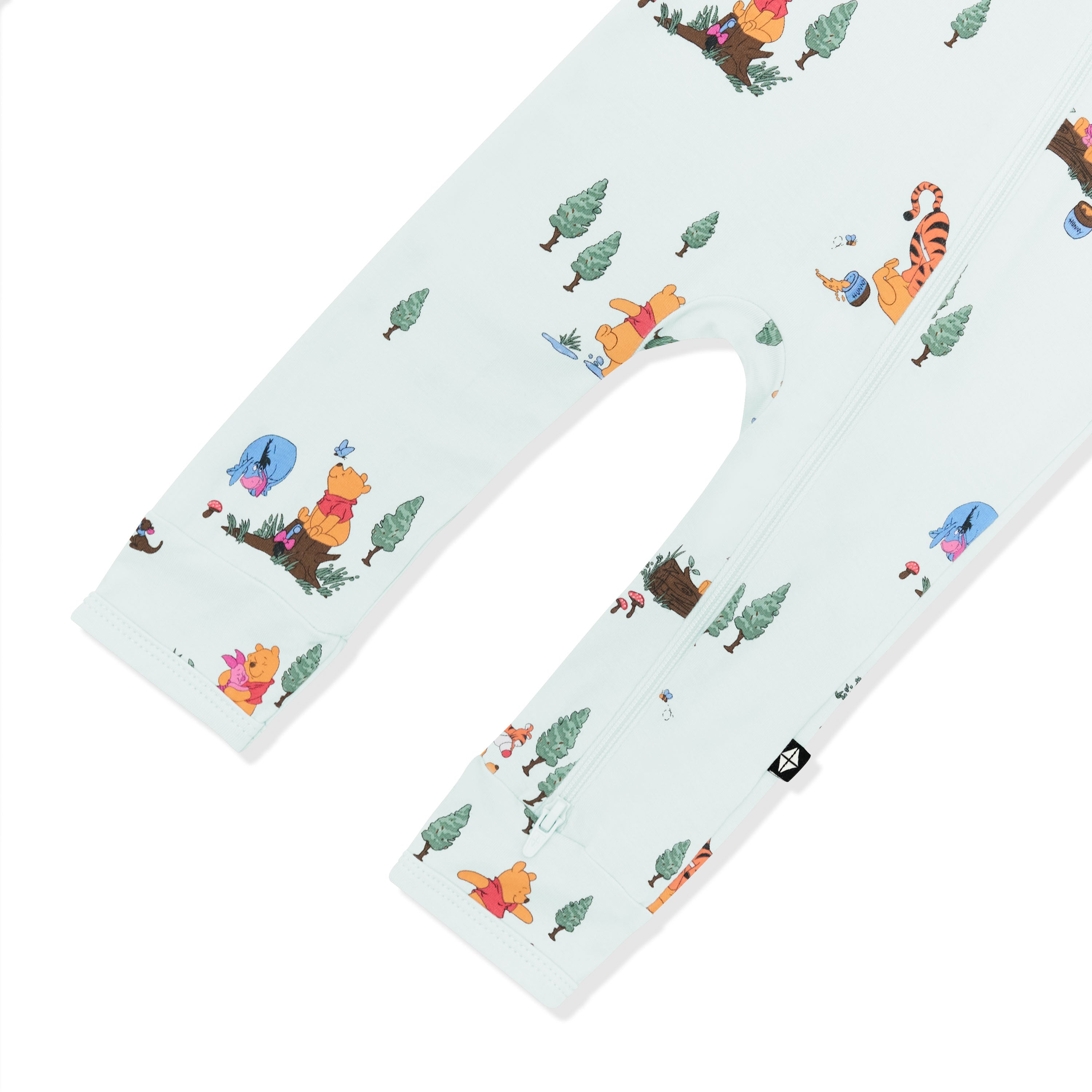 Close up of the zipper closure shown on the leg of the Zippered Romper in Winnie the Pooh Hundred Acre Wood