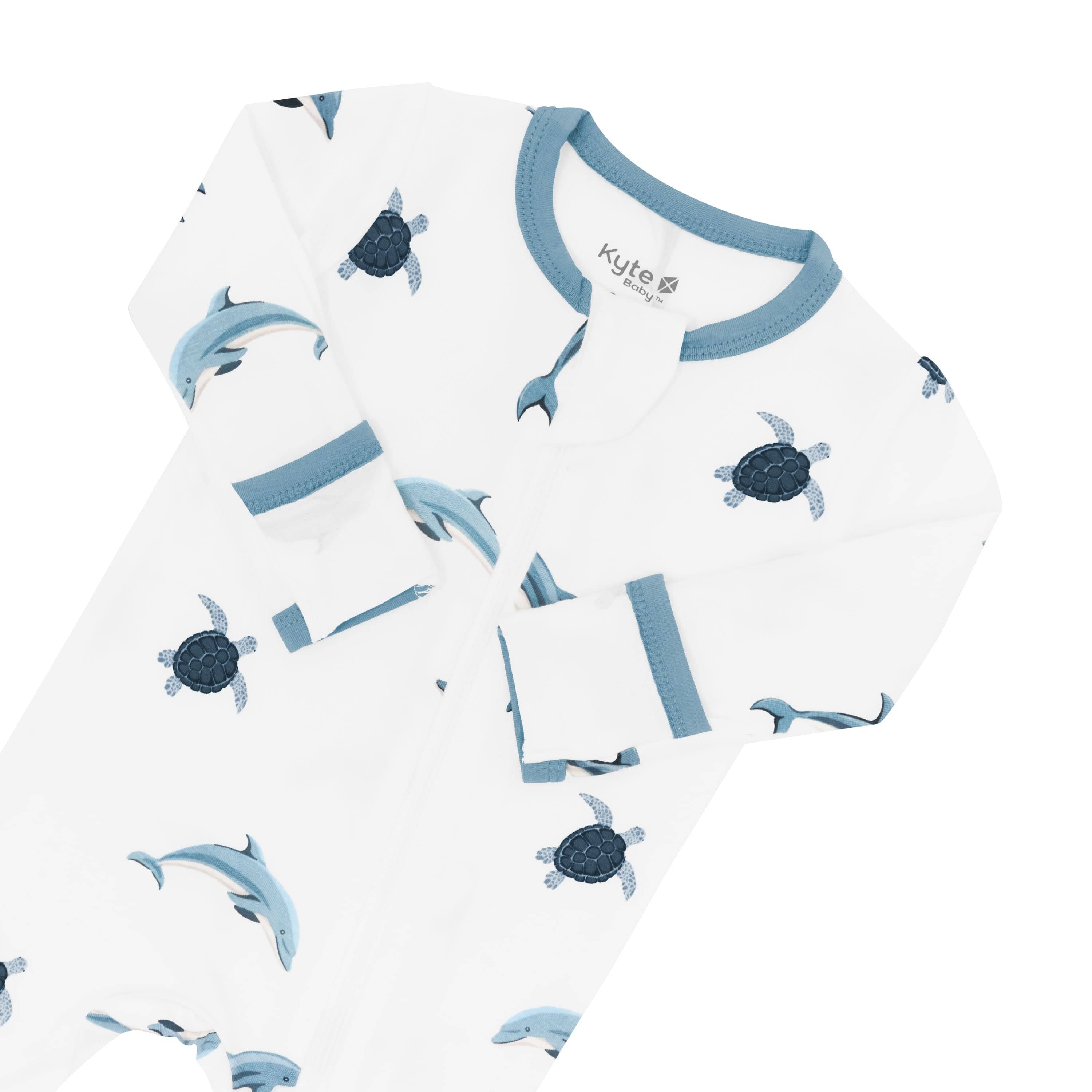 Zippered Footie in Dolphin showing foldable mittens and zipper garage