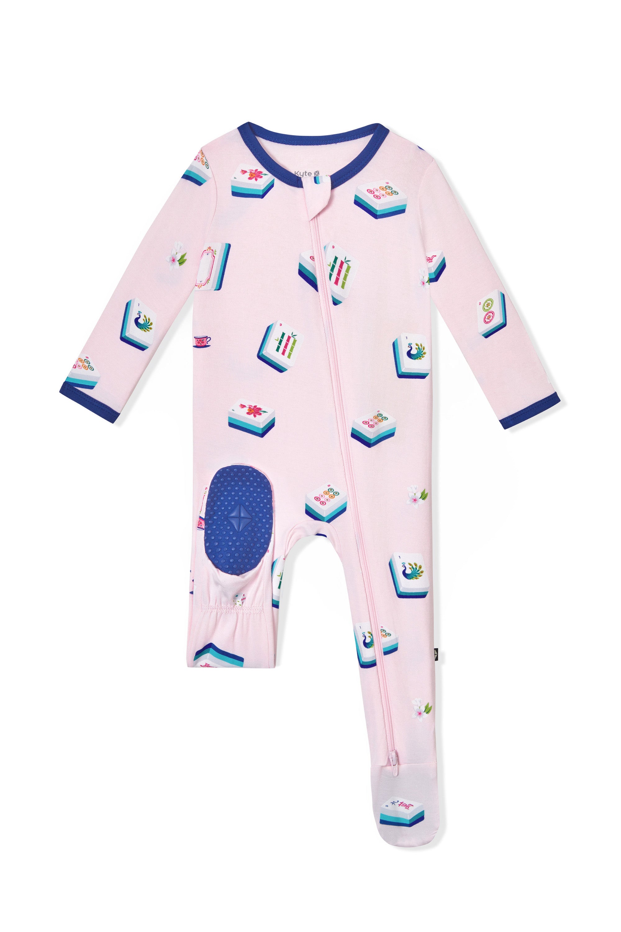 Dotted navy footie on pink Zippered Footie with Mahjong pattern on a white background