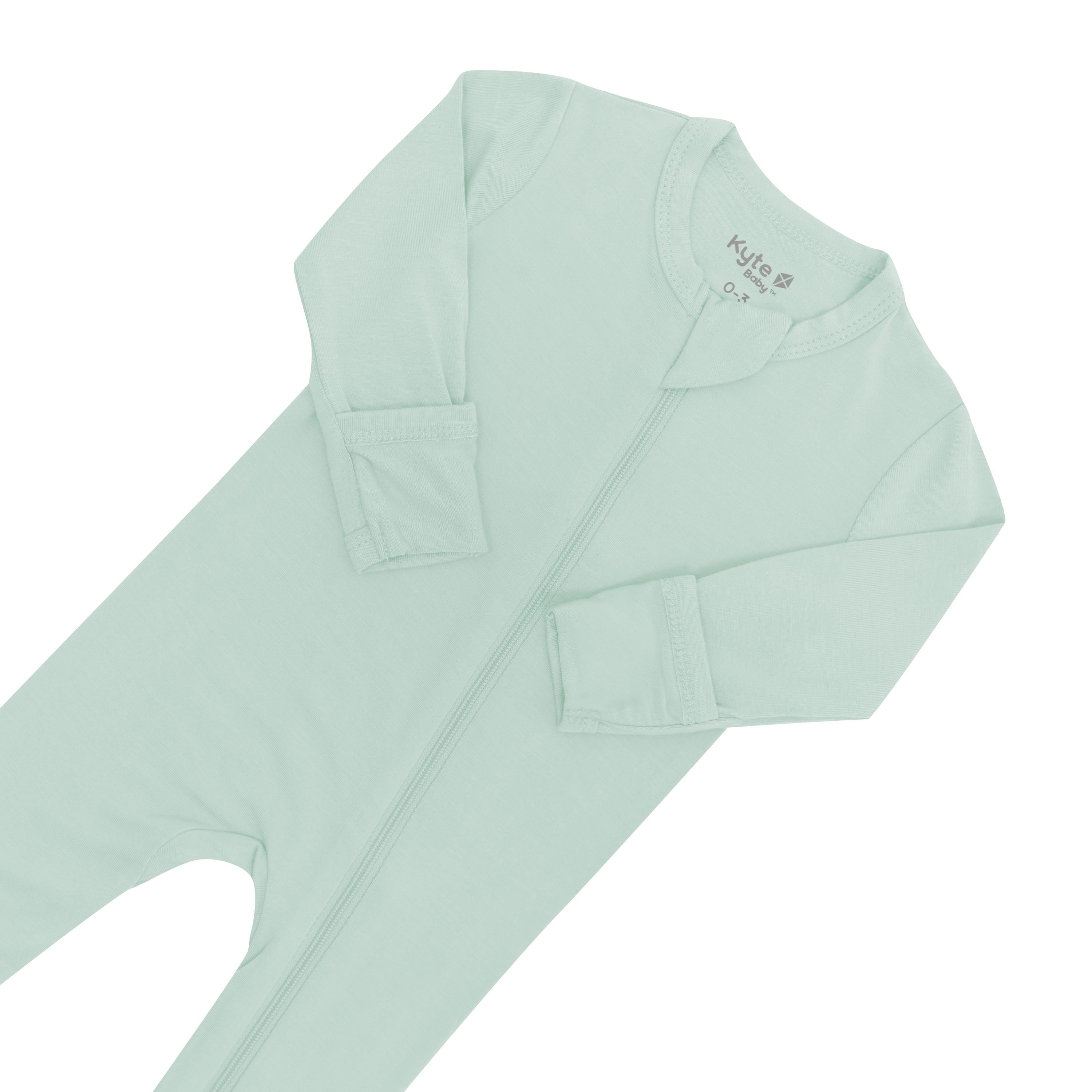 Close up of zipper garage and fold-over cuffs on Zippered Romper in Sage
