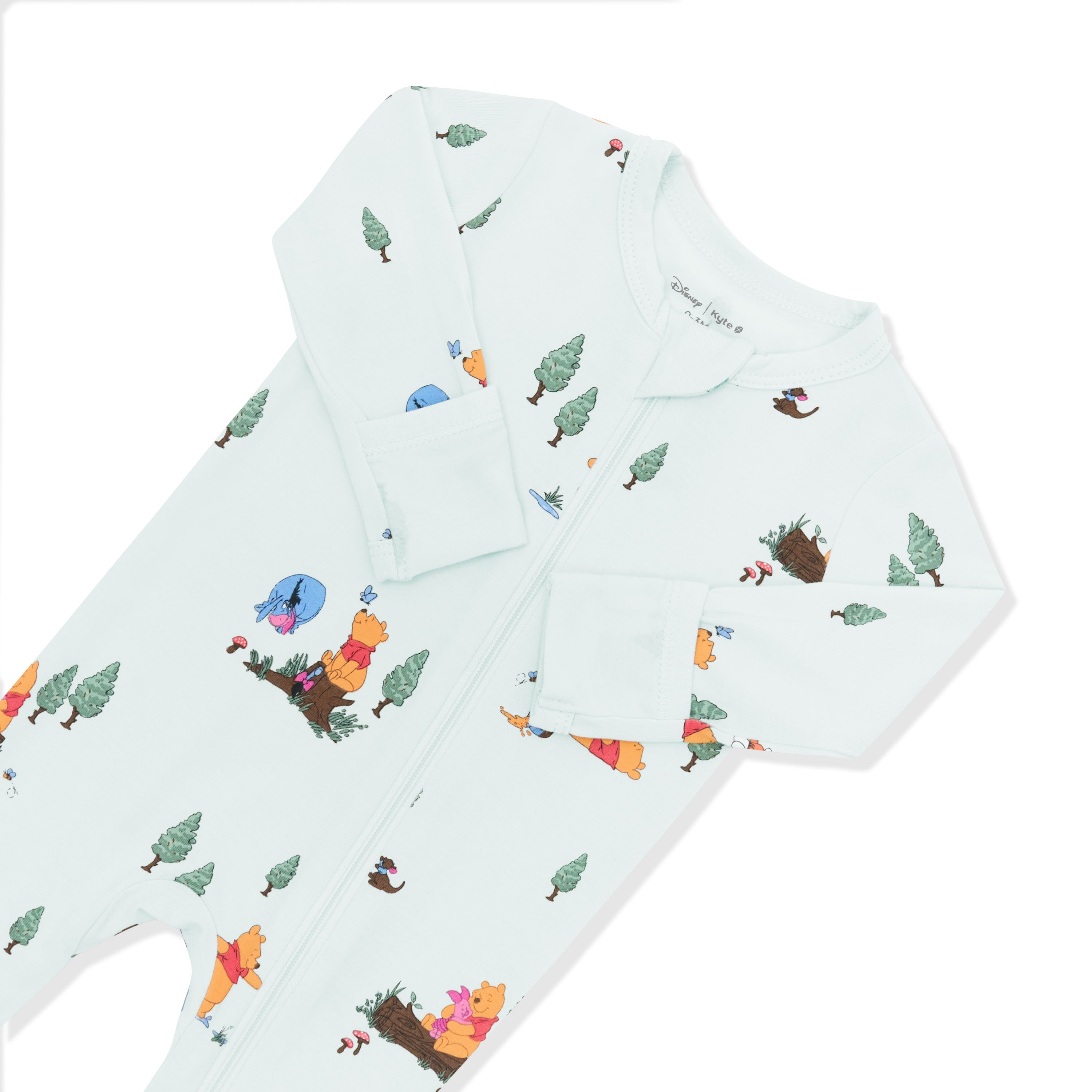 Close up of the zipper and fold over hand cuffs shown on the Zippered Footie in Winnie the Pooh Hundred Acre Wood