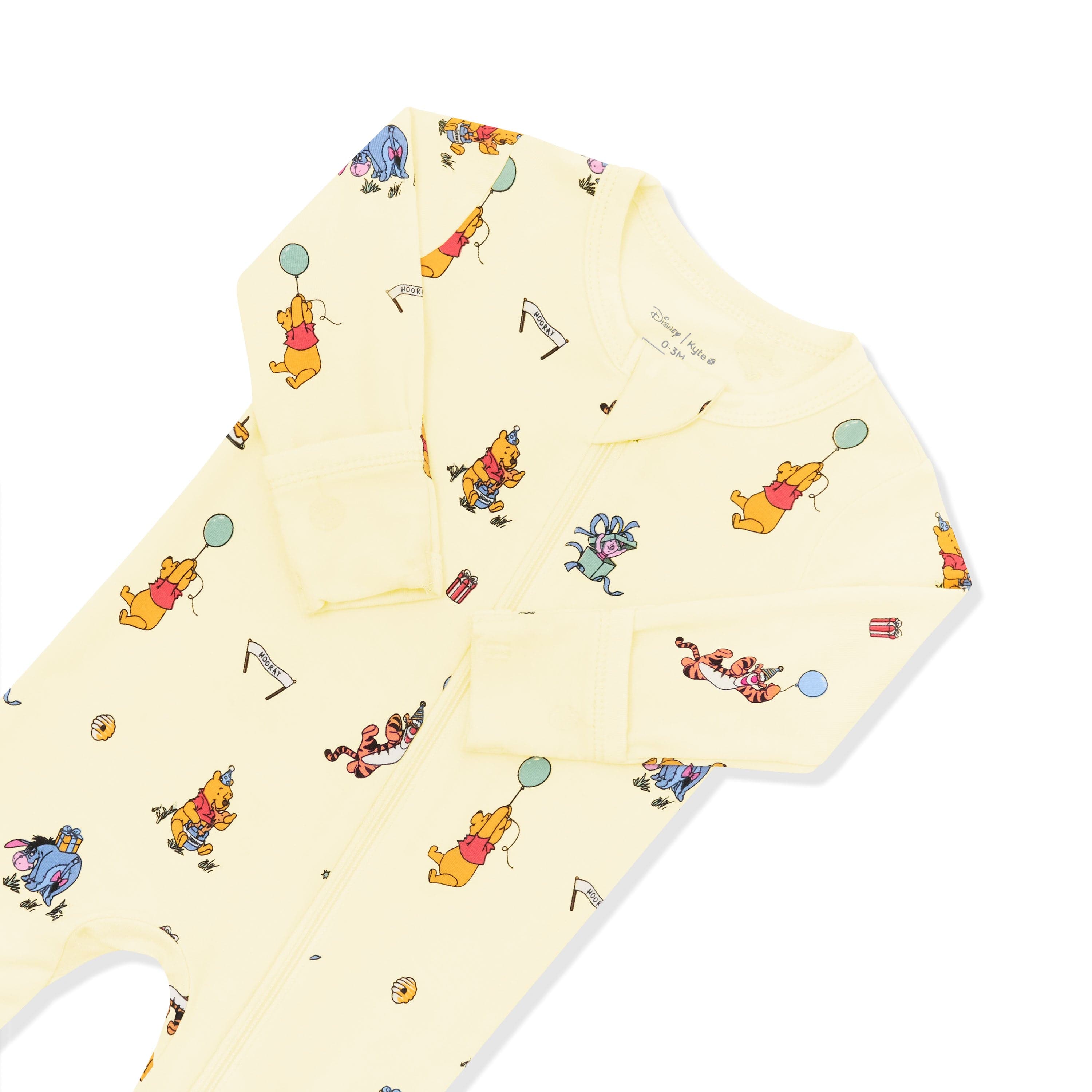 Close up of the zipper garage and fold over hand cuffs shown on the Zippered Footie in Winnie the Pooh Celebration