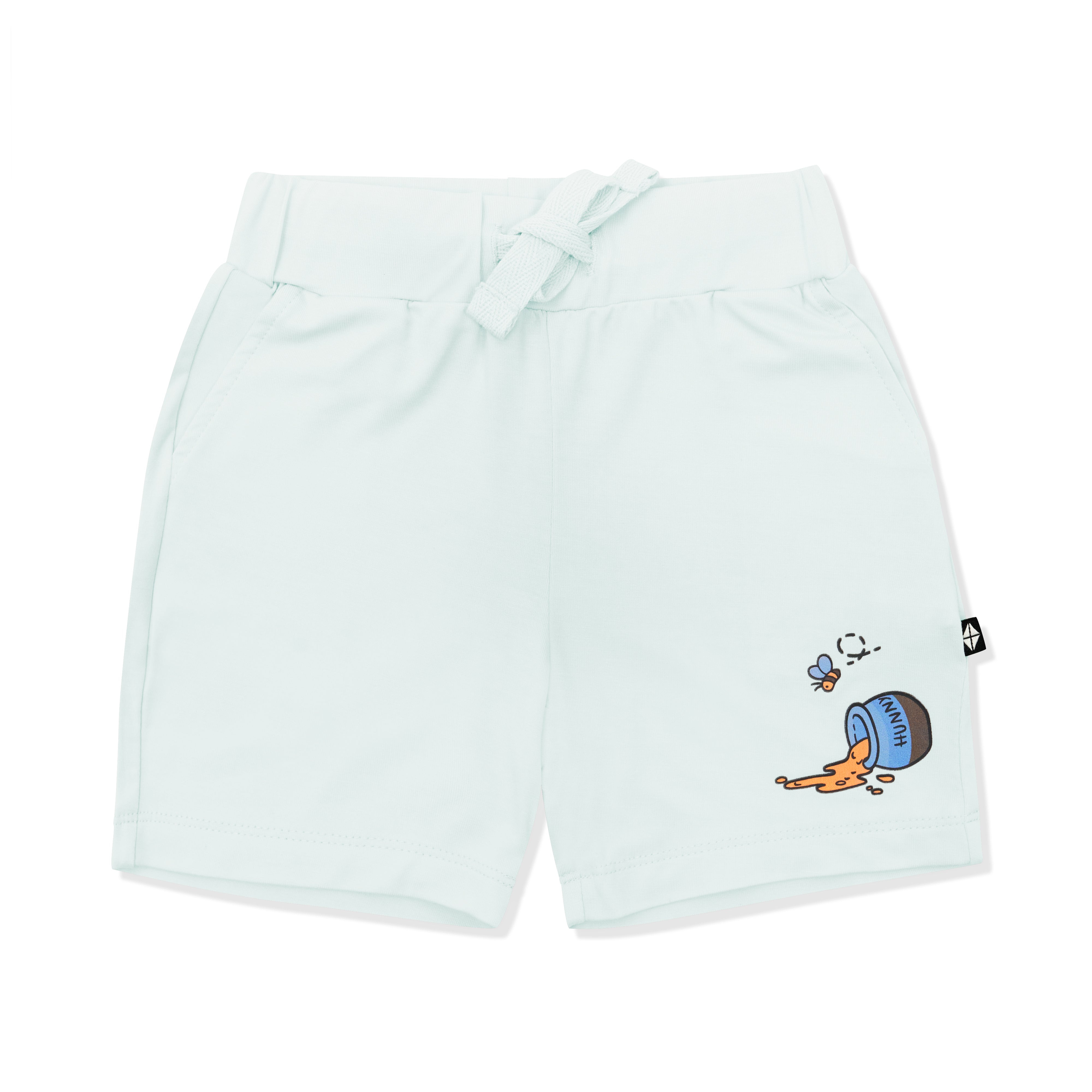 Light green drawstring shorts showing a honey pot tipped over with honey coming out on the right leg