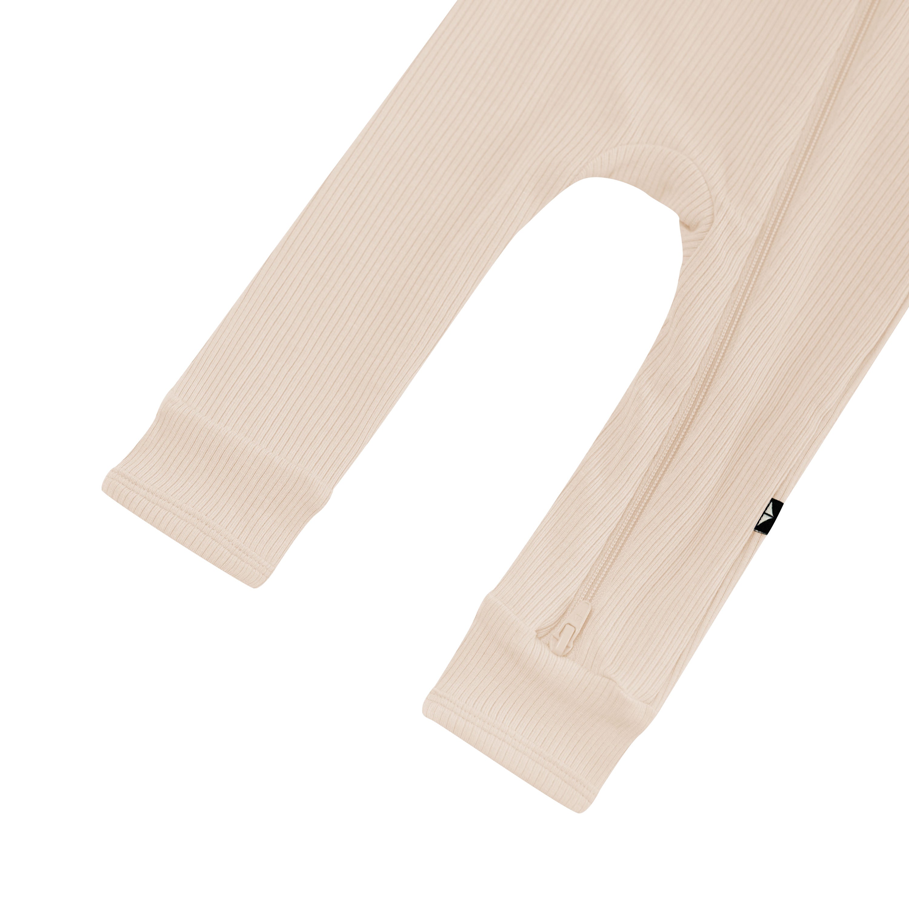 Zipper shown on the leg of the Ribbed Zipper Romper in Bisque