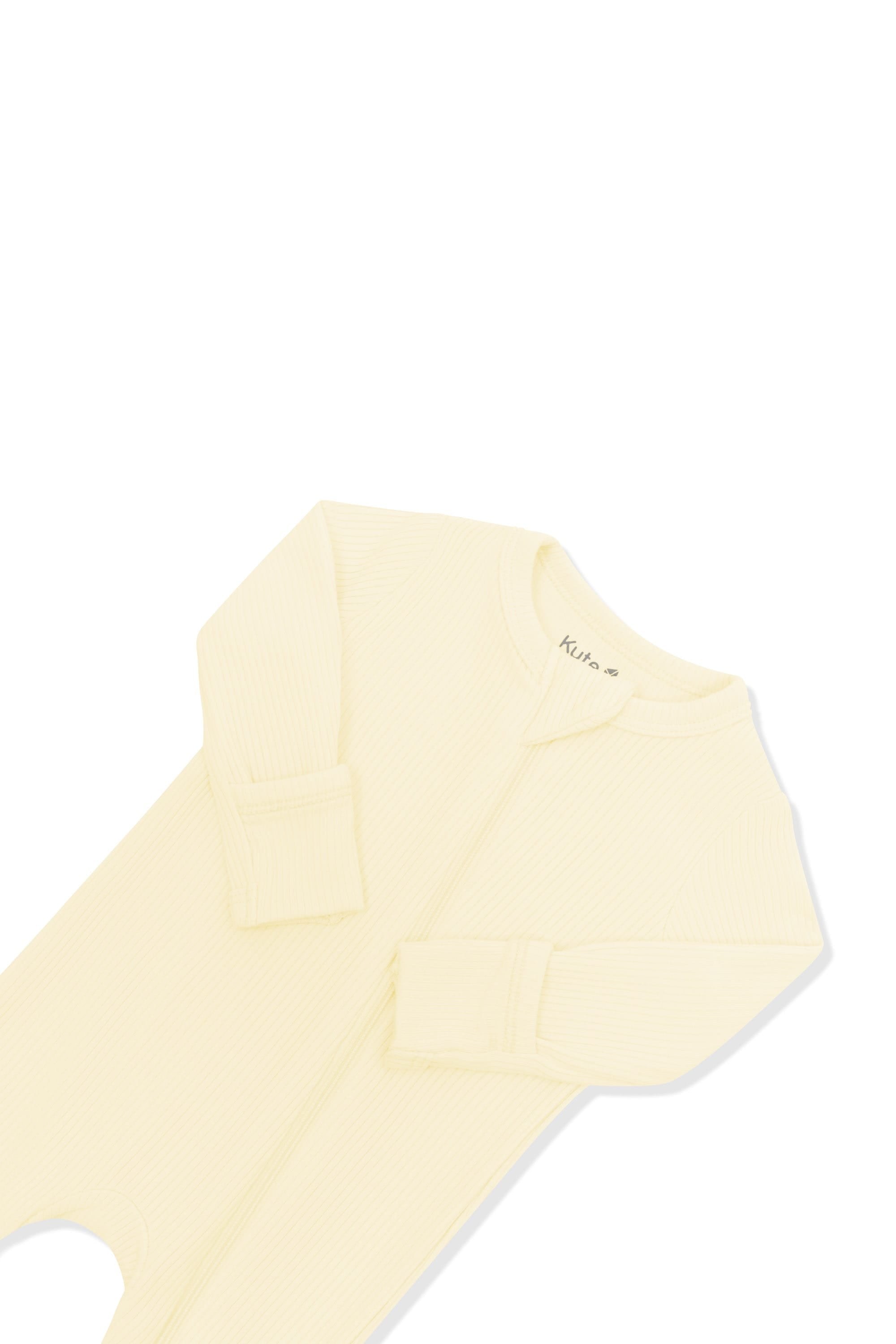 Close up of the zipper garage and fold over hand cuffs on the Ribbed Zipper Romper in Chamomile