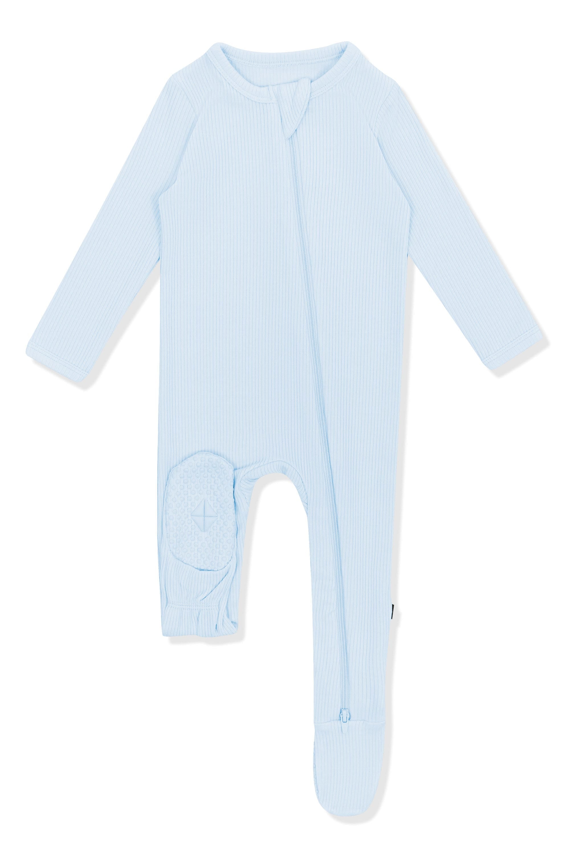 The bottom of the foot pad on the Ribbed Zipper Footie in Breeze