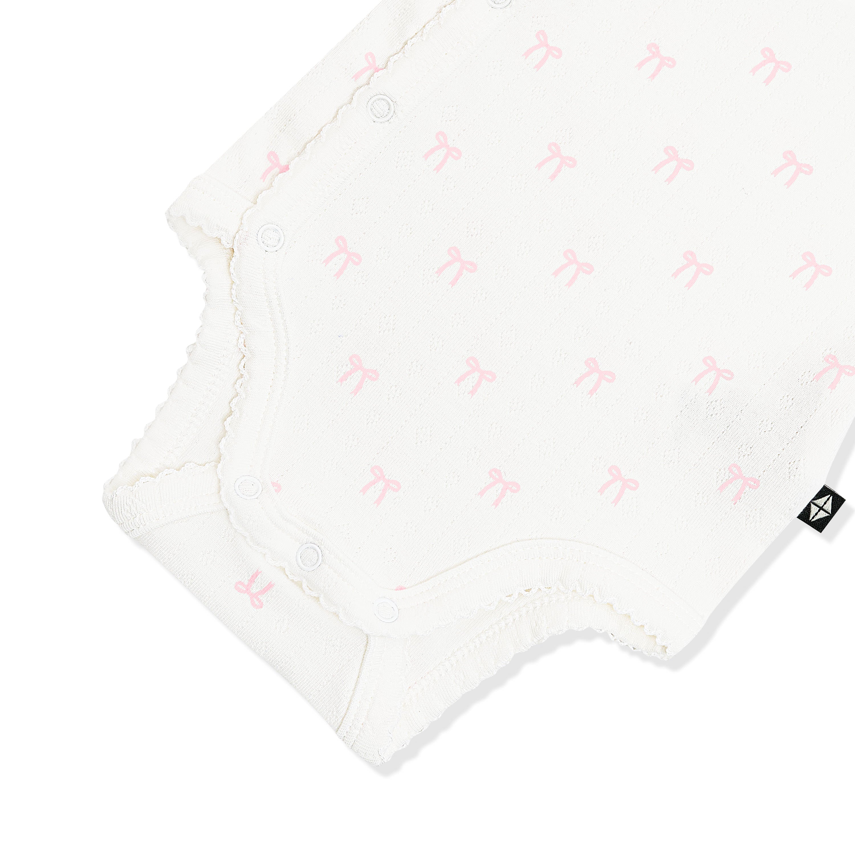 Close up of the picot trim and snap closure on the inseam shown on the Pointelle Kimono Bodysuit in Sweet Pink Bow