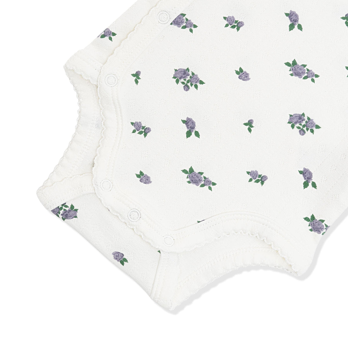 Close up of the picot trim and snap closures on the inseam shown on the Pointelle Kimono Bodysuit in Spray Rose