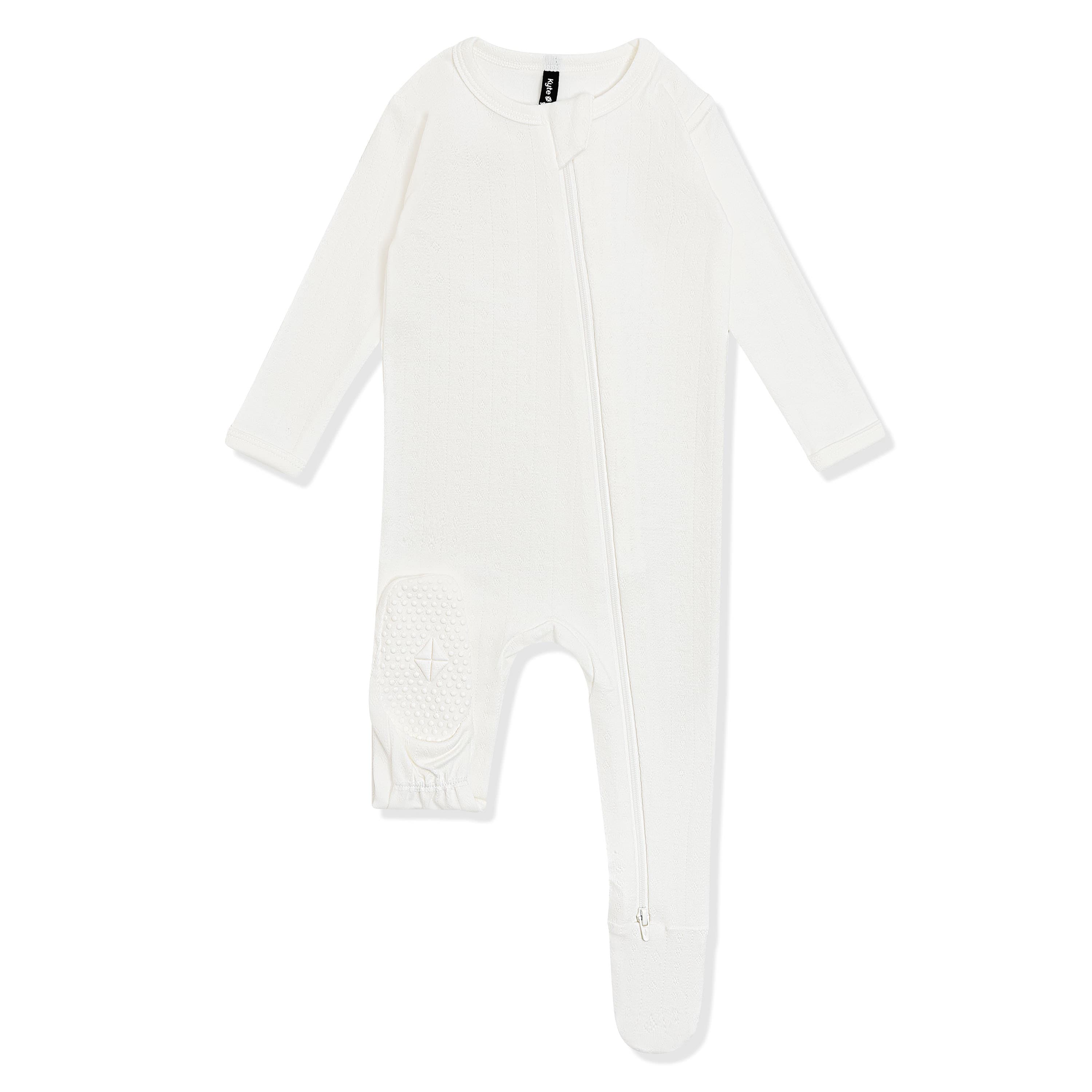 The foot pad with the Kyte Baby logo shown on the Pointelle Zippered Footie in Cloud