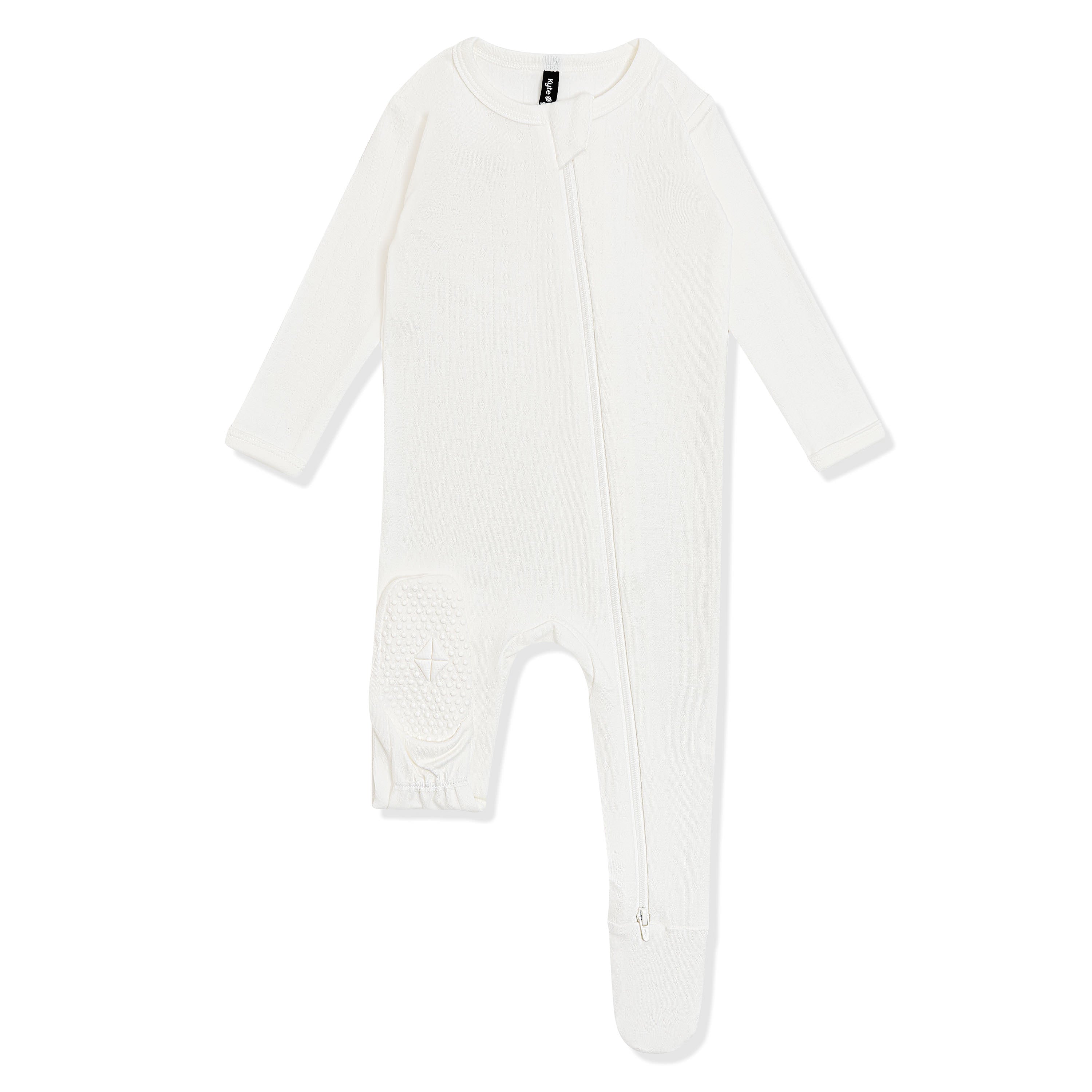 The foot pad with the Kyte Baby logo shown on the Pointelle Zippered Footie in Cloud
