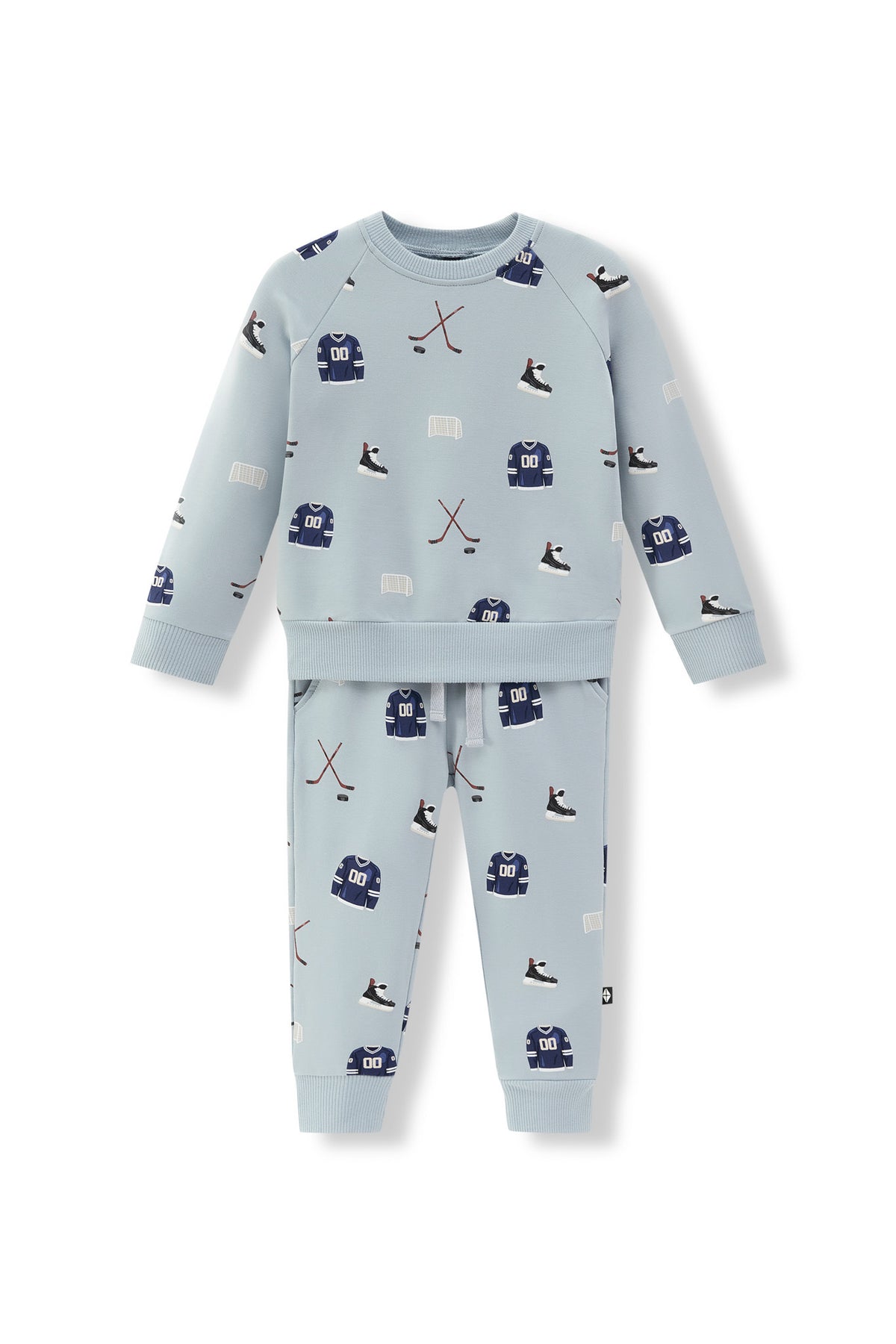 A two-piece kids' set in light blue, featuring a long-sleeve top and matching pants with an all-over hockey print of skates, pucks, and sticks.