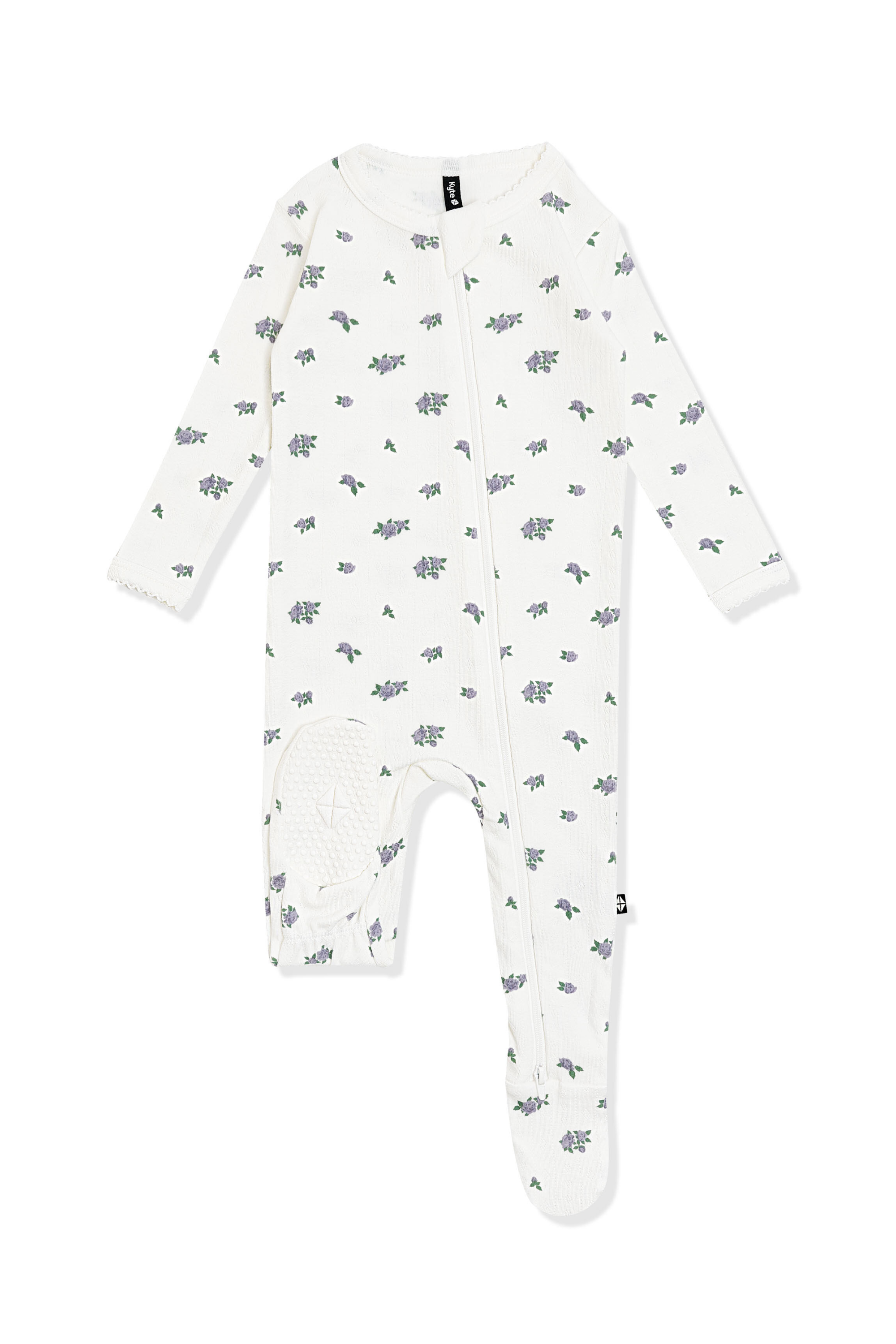 The bottom of the foot pad showing the kyte baby logo on the Pointelle Zippered Footie in Spray Rose with picot trim