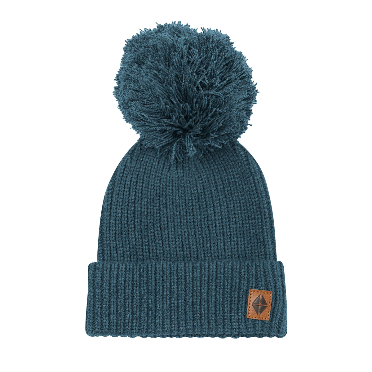 Product photo of the Chunky Knit Pom Beanie in Atlantic with the Kyte Baby vegan leather tag visible