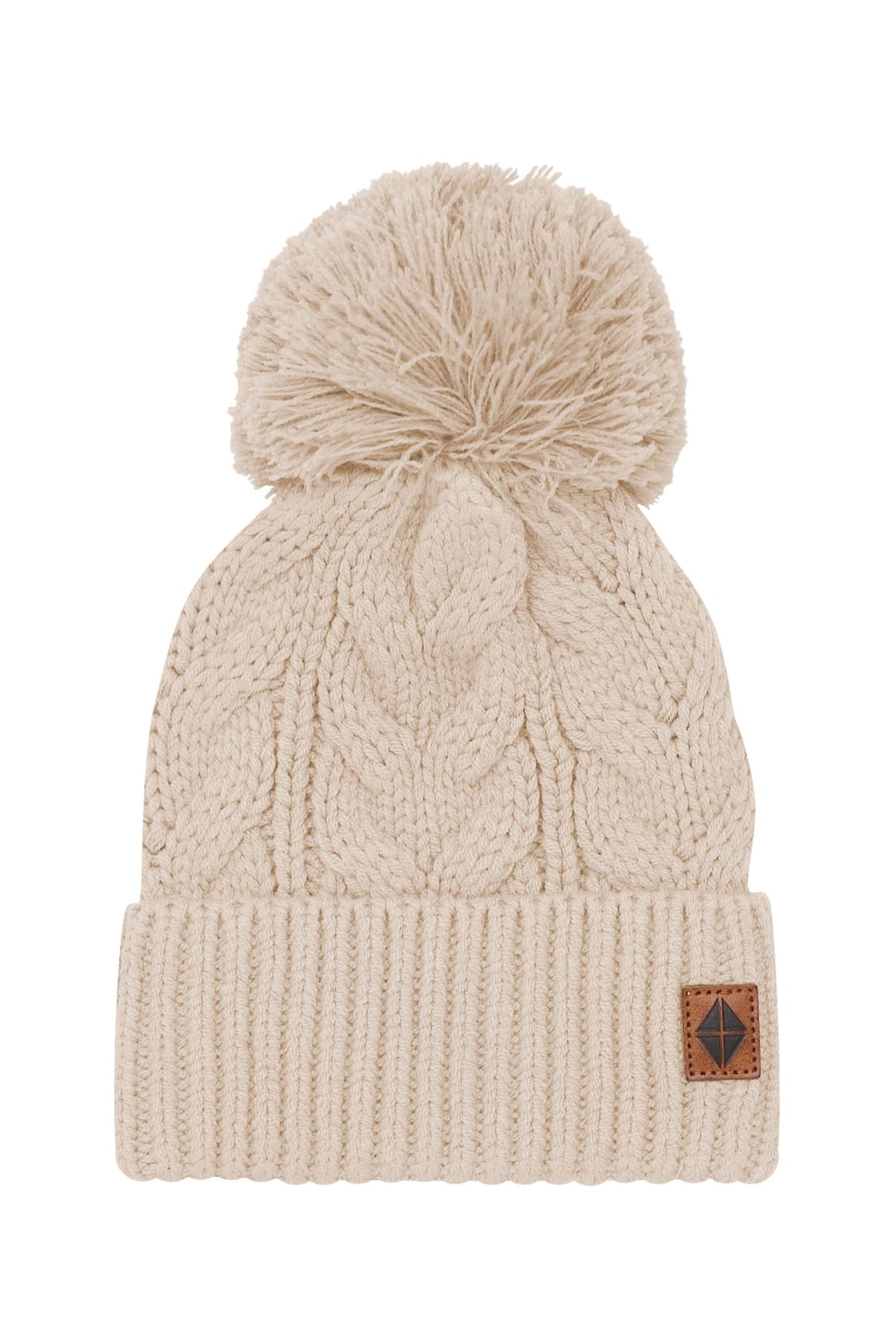 Product photo of the Chunky Cable Knit Beanie in Almond with the Kyte Baby Vegan leather tag visible