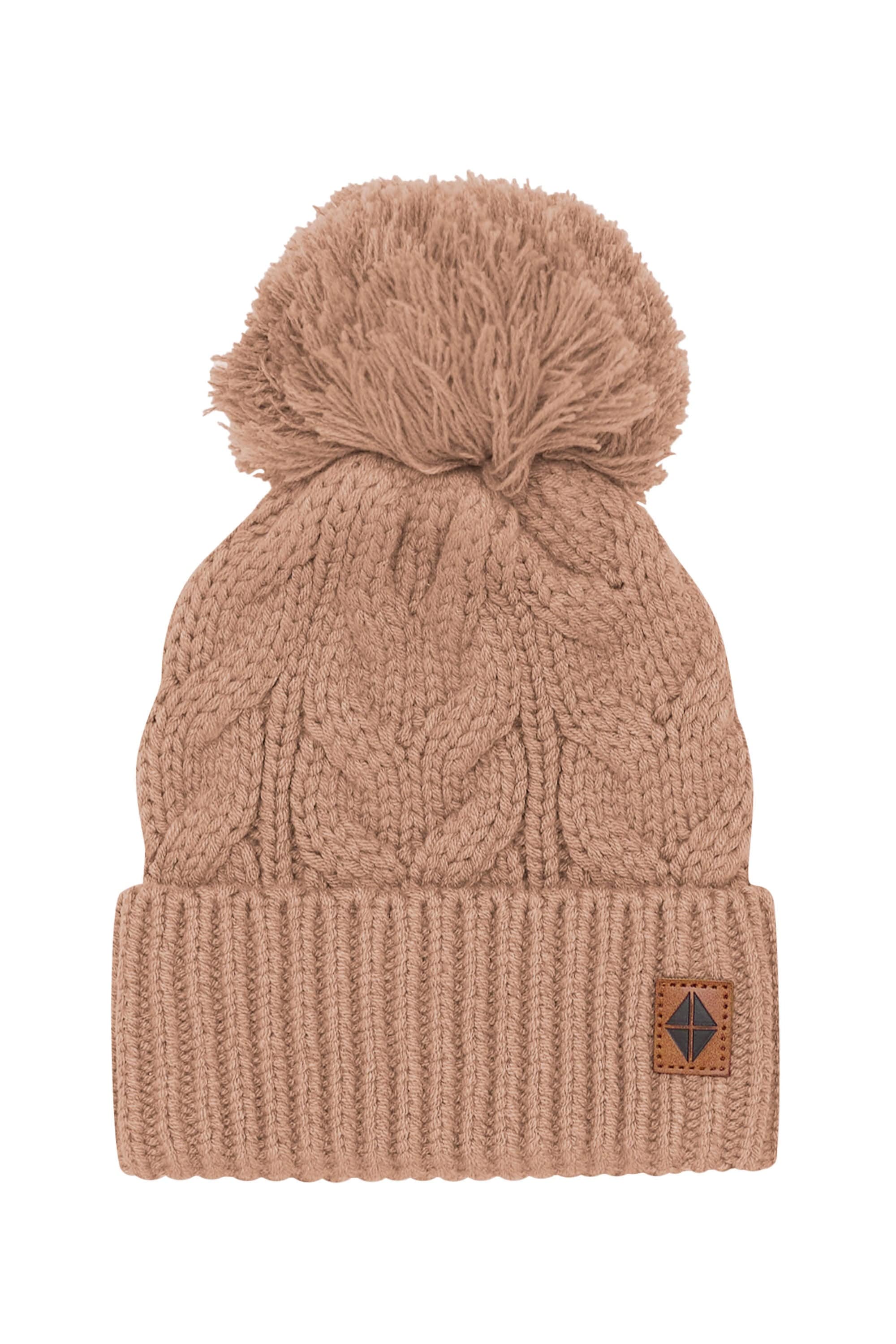 Product photo of the Chunky Cable Knit Beanie in Latte with the Kyte Baby vegan leather tag visible