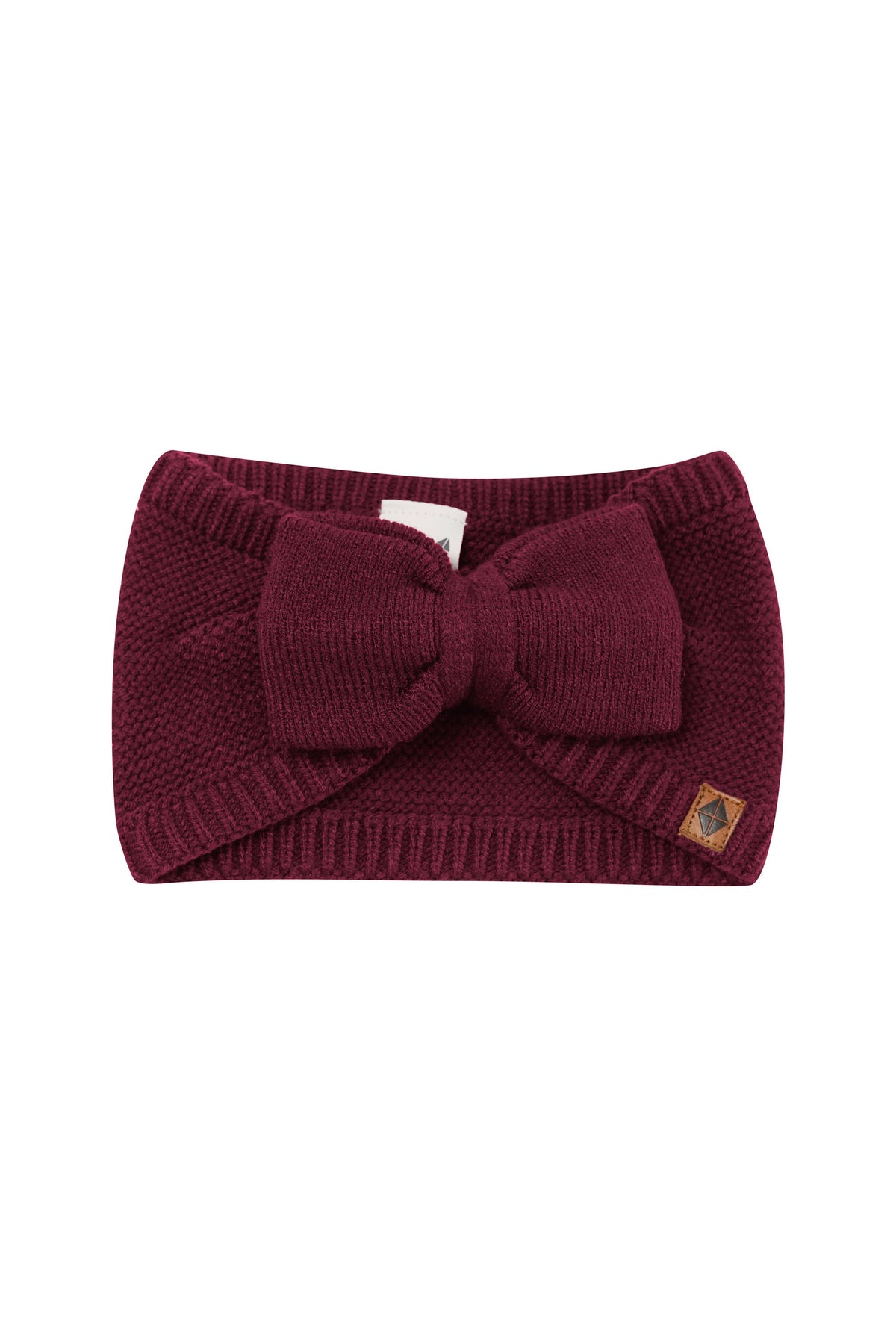 Product photo of the Chunky Knit Bow Headband in Burgundy with the Kyte Baby vegan leather tag visible
