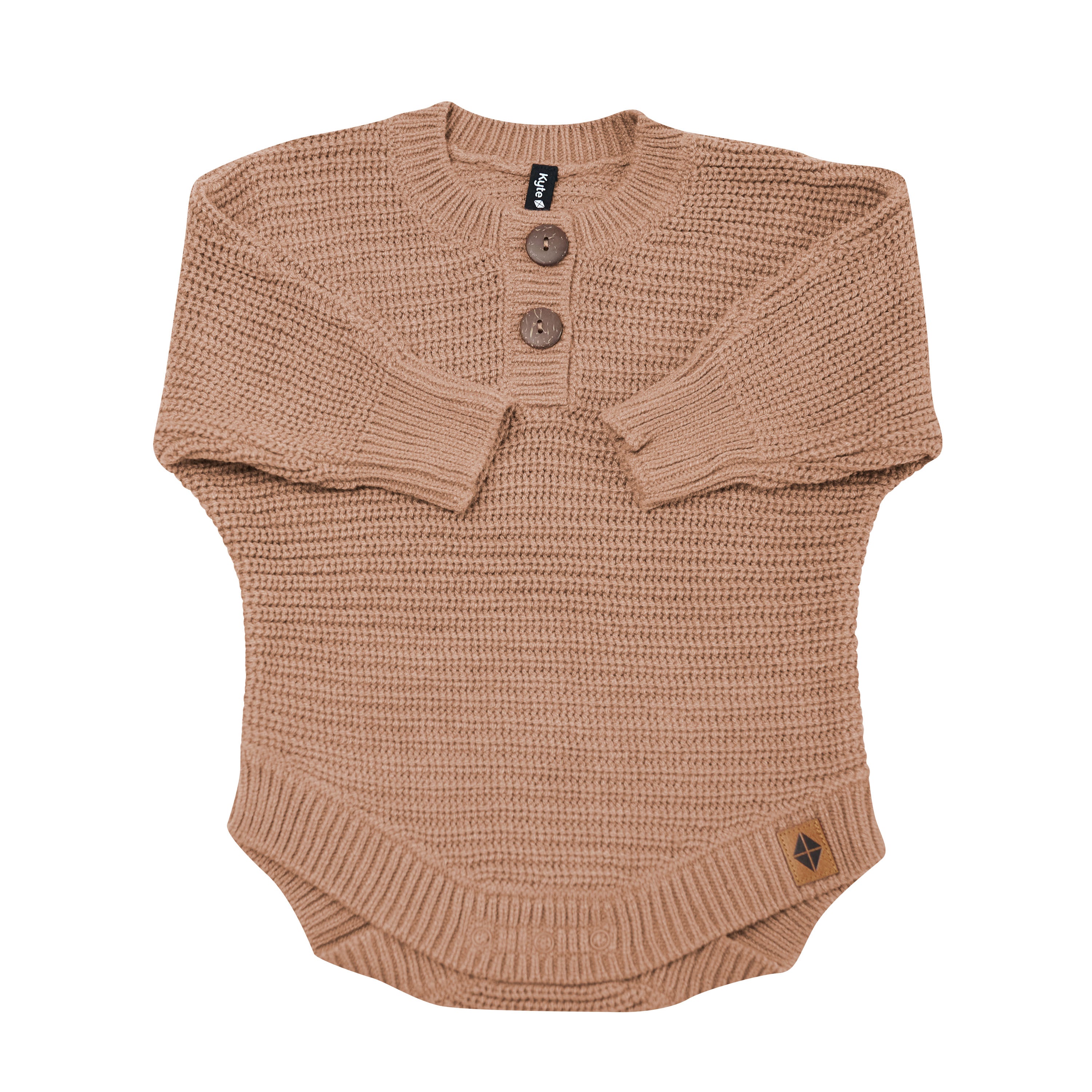 Chunky Knit Romper in Latte shown with the arms folded inwards