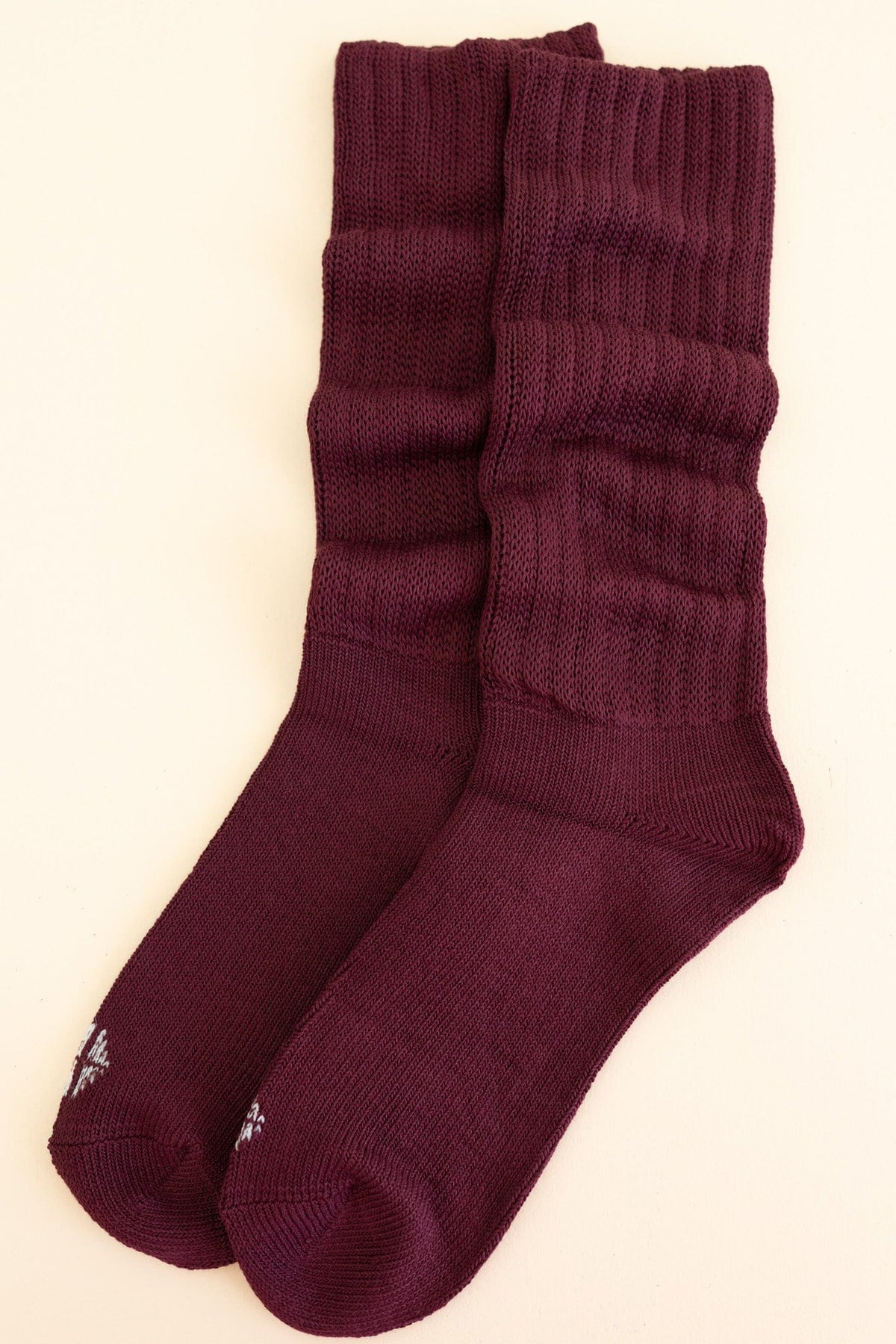 Adult Scrunch Socks in Burgundy shown laying side by side on a light neutral background