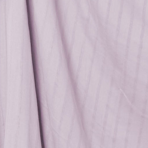 Close-up of light purple fabric with a subtle pattern
