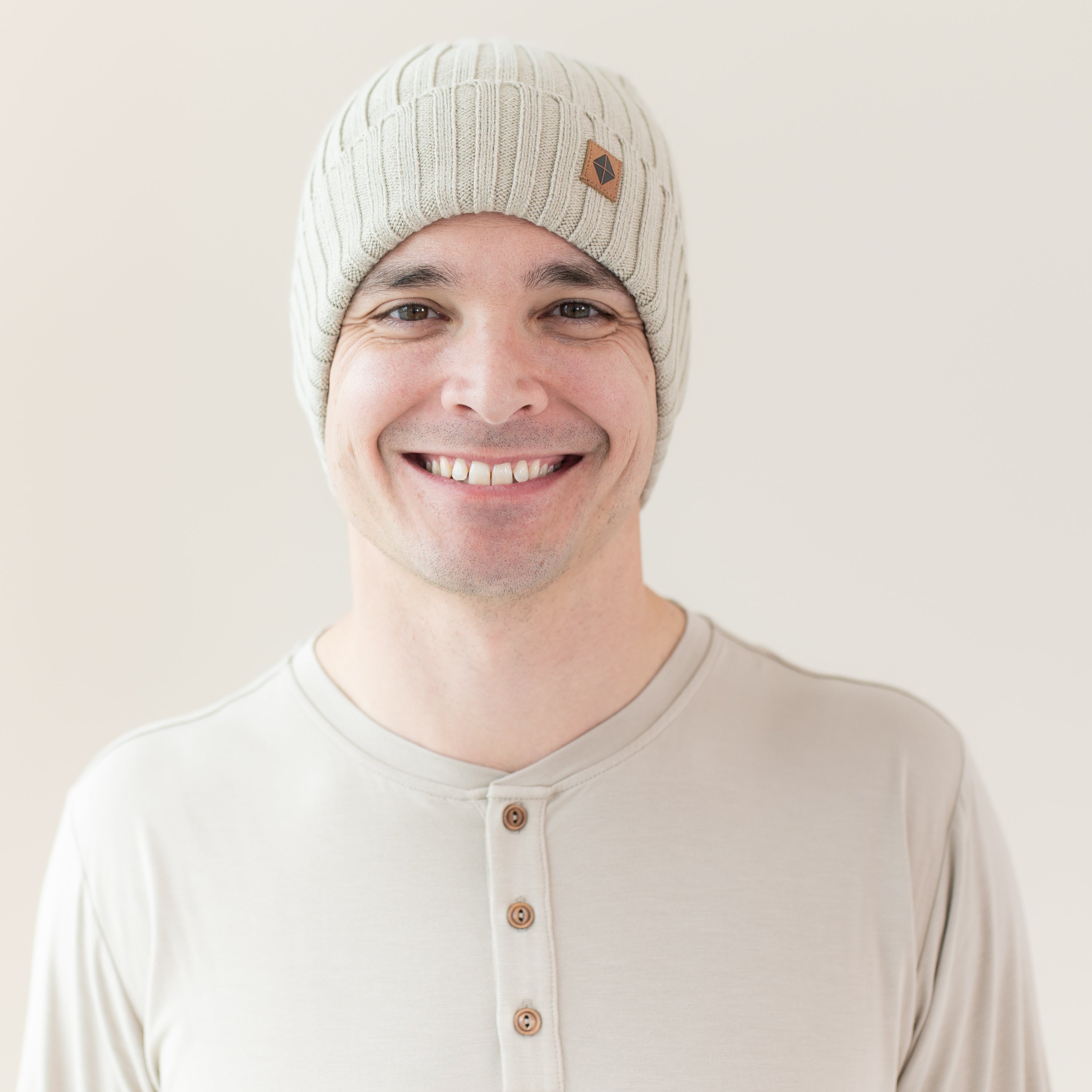 Man modeling Chunky Knit Adult Ribbed Beanie in Almond
