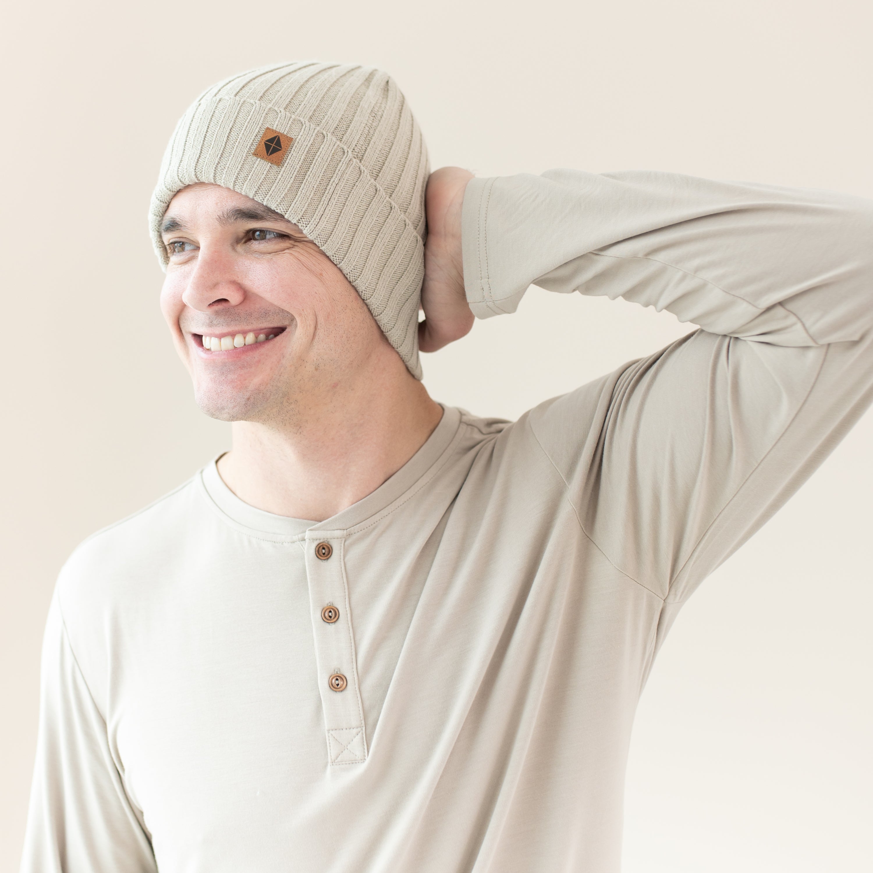 Man modeling Chunky Knit Adult Ribbed Beanie in Almond side view