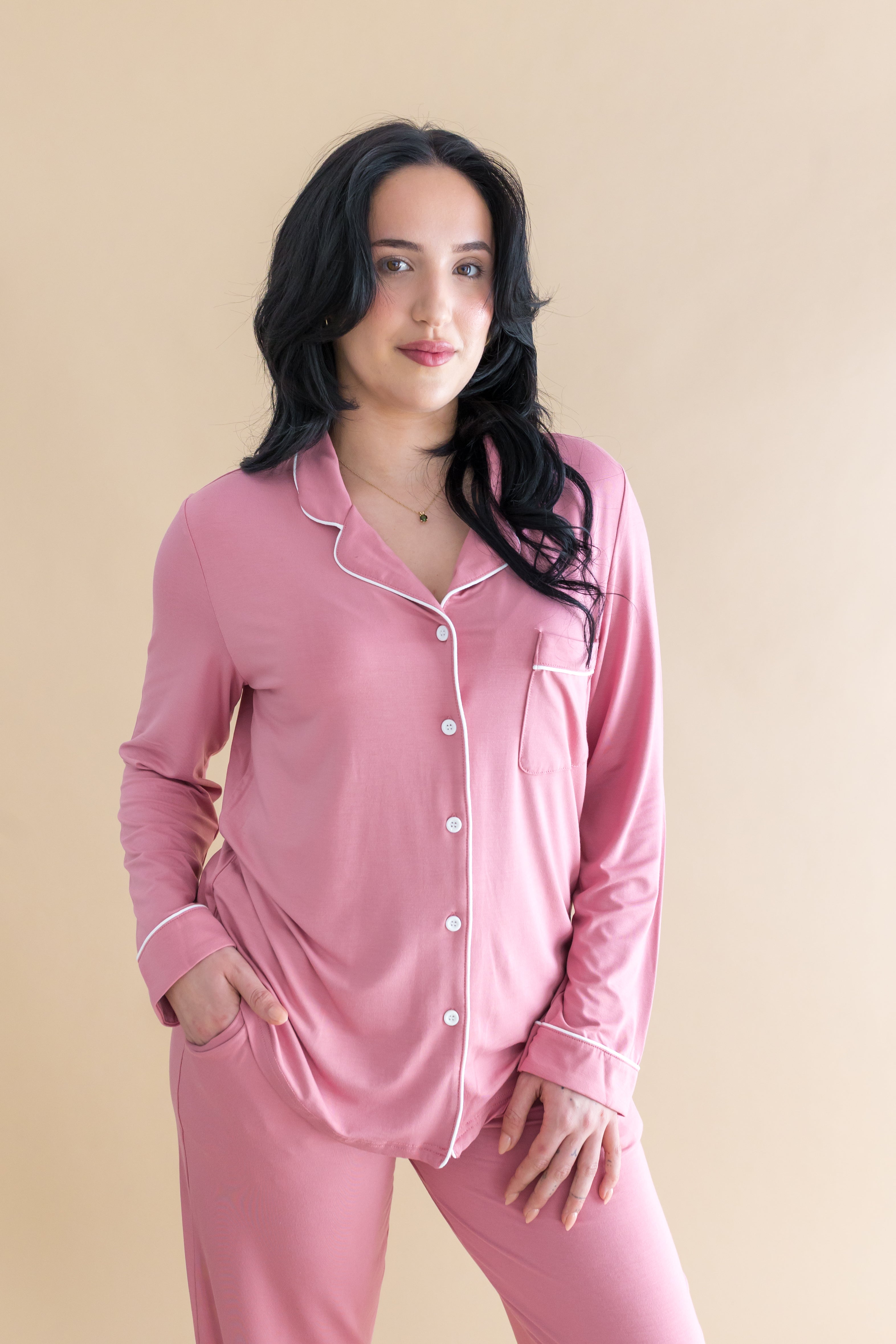 Female modeling the Long-Sleeved Women's Pajama Set in Apple Blossom with Cloud Trim in front of a light taupe background
