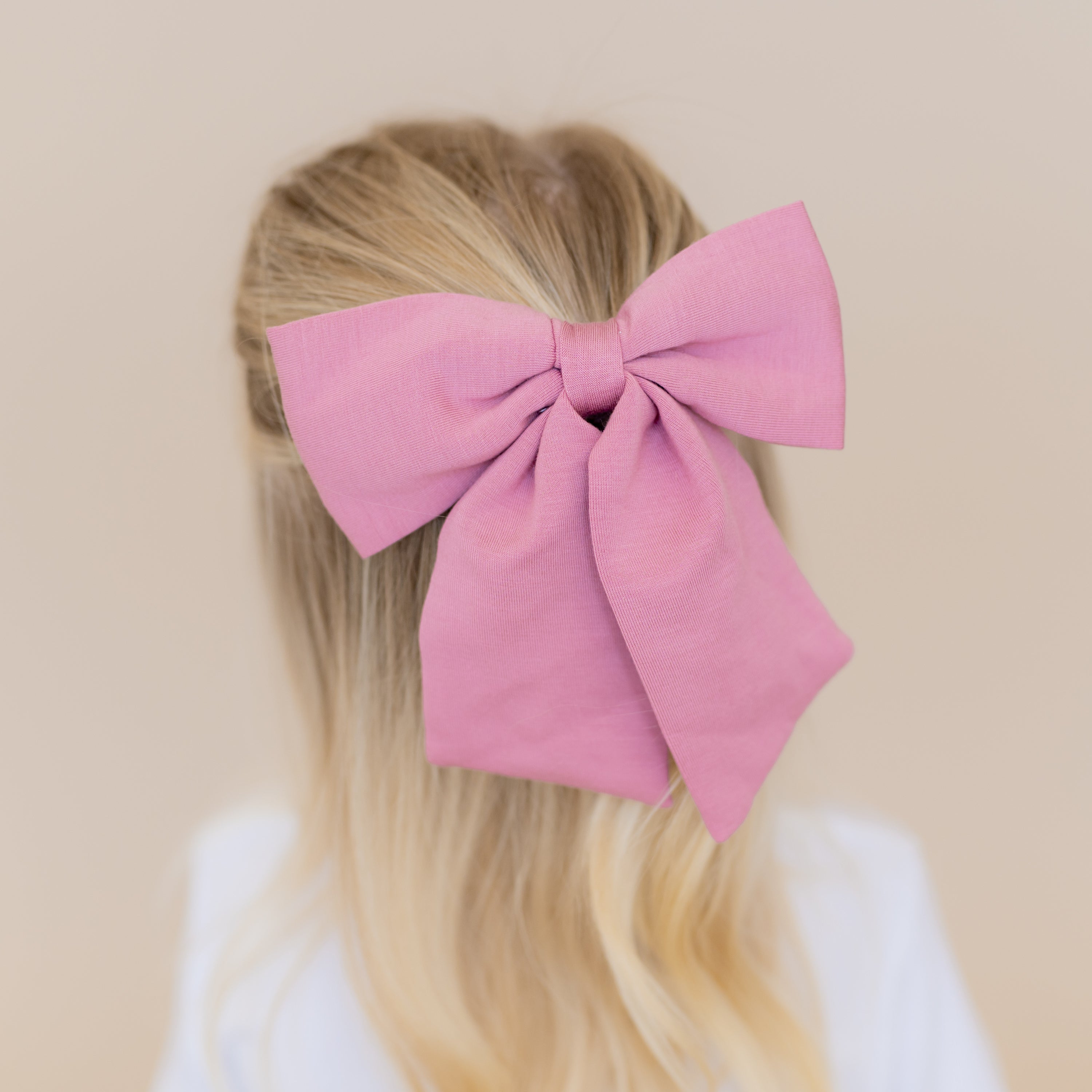 Large Alligator Clip Bow in Apple Blossom shown in a young girls hair