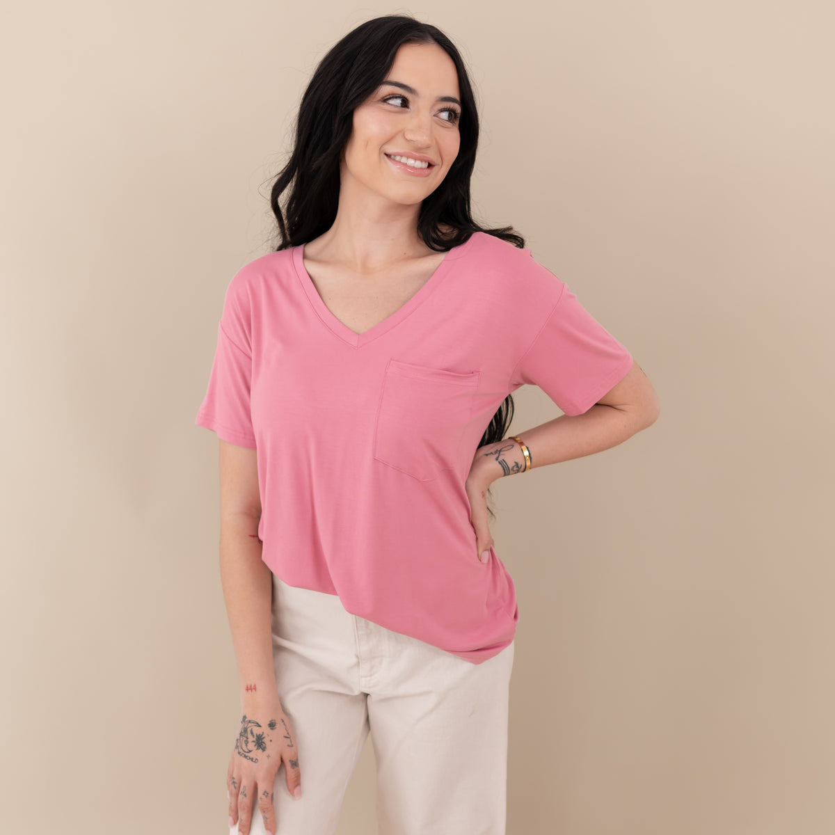 Woman wearing Kyte Baby Women's Relaxed Fit V-Neck in Apple Blossom