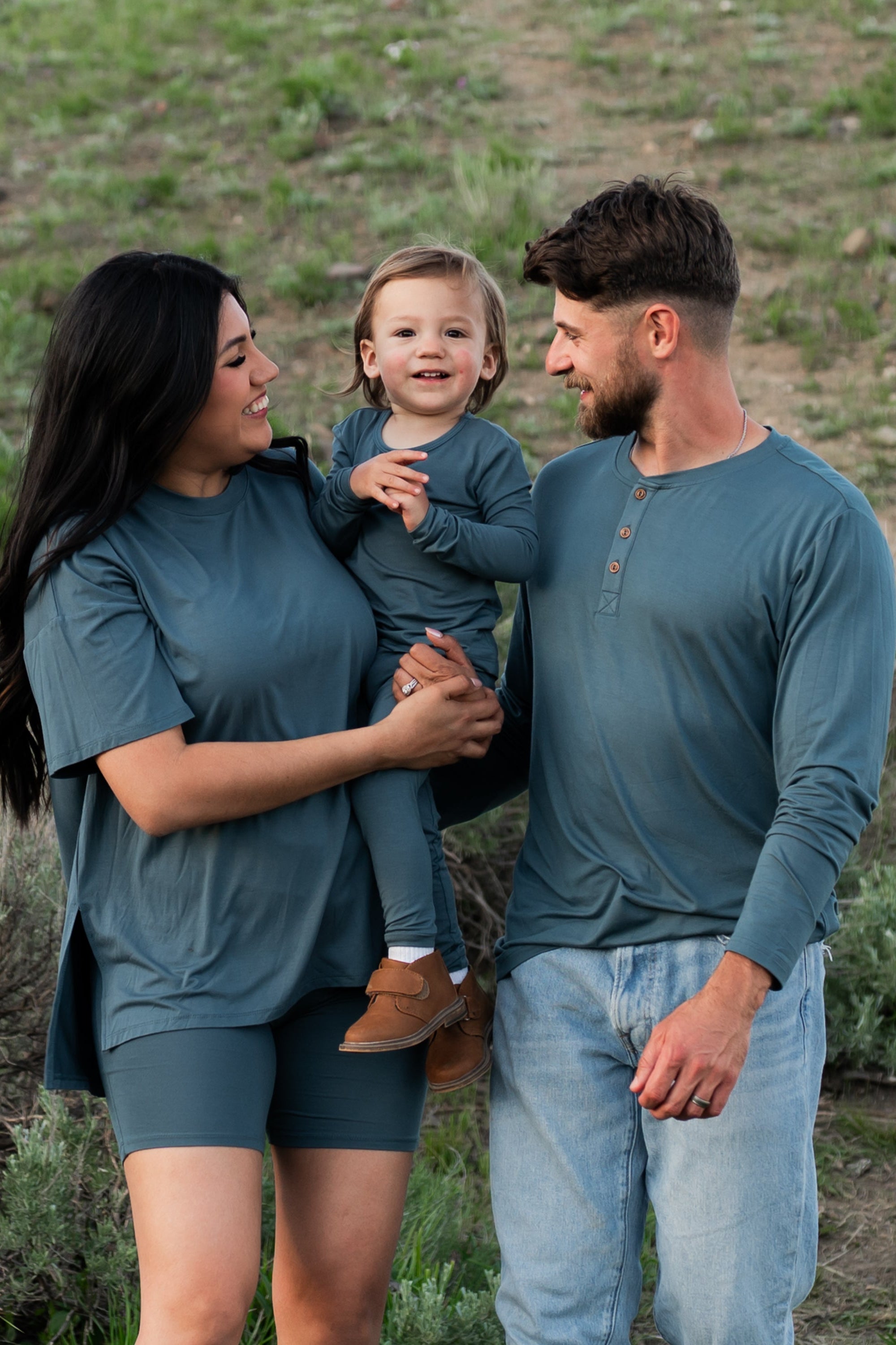Family matching in Atlantic items. Pictured are the Women's Biker short set, toddler long sleeve pajamas and men's long sleeve henley top