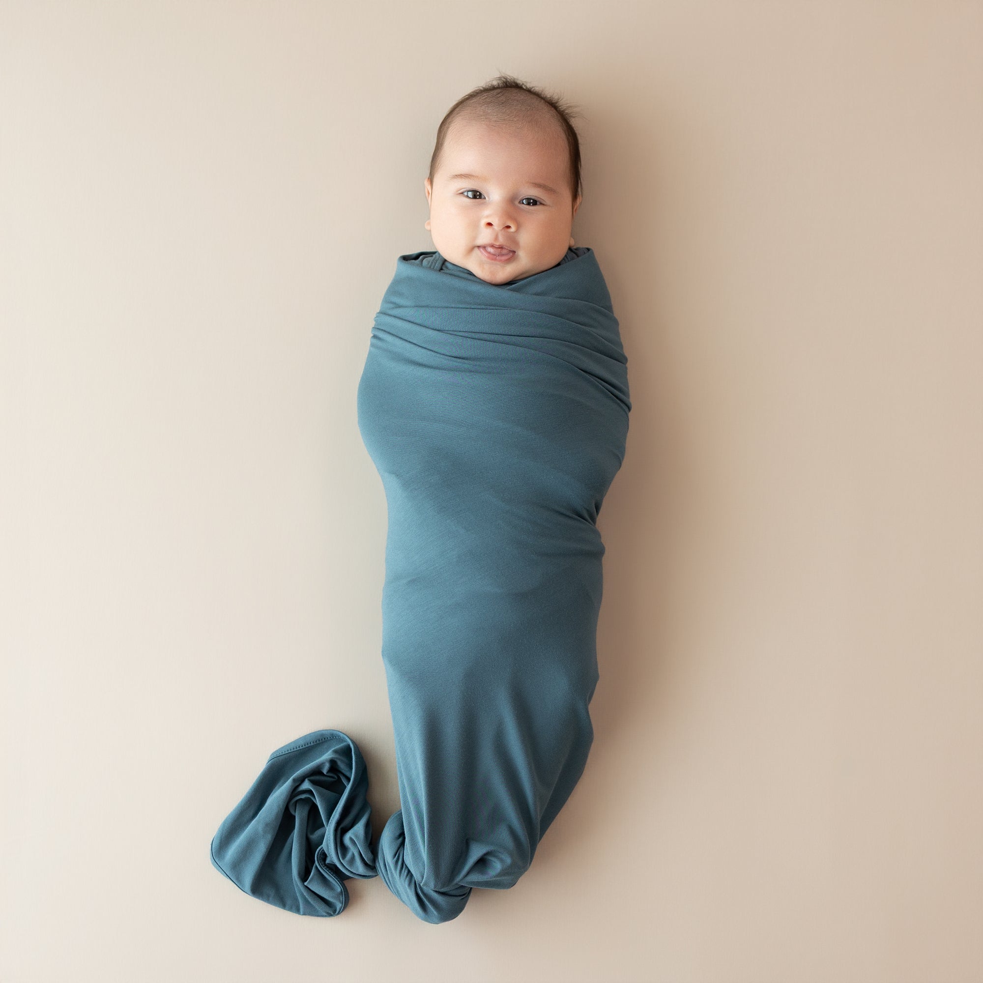 Infant swaddled in the Swaddle Blanket in Atlantic