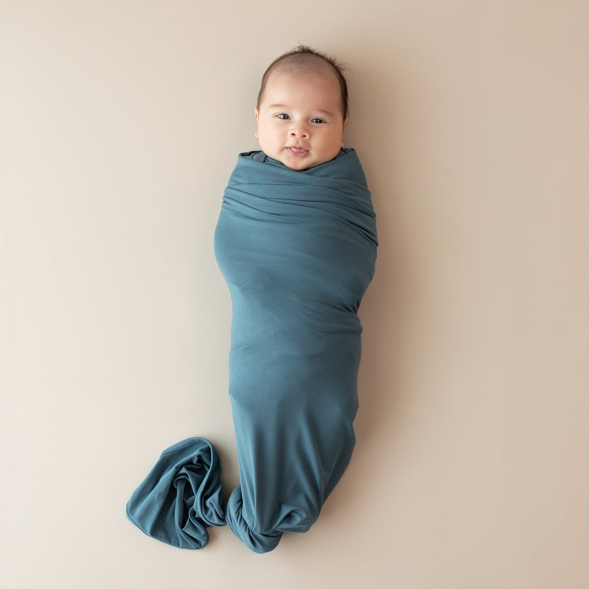 Infant swaddled in the Swaddle Blanket in Atlantic
