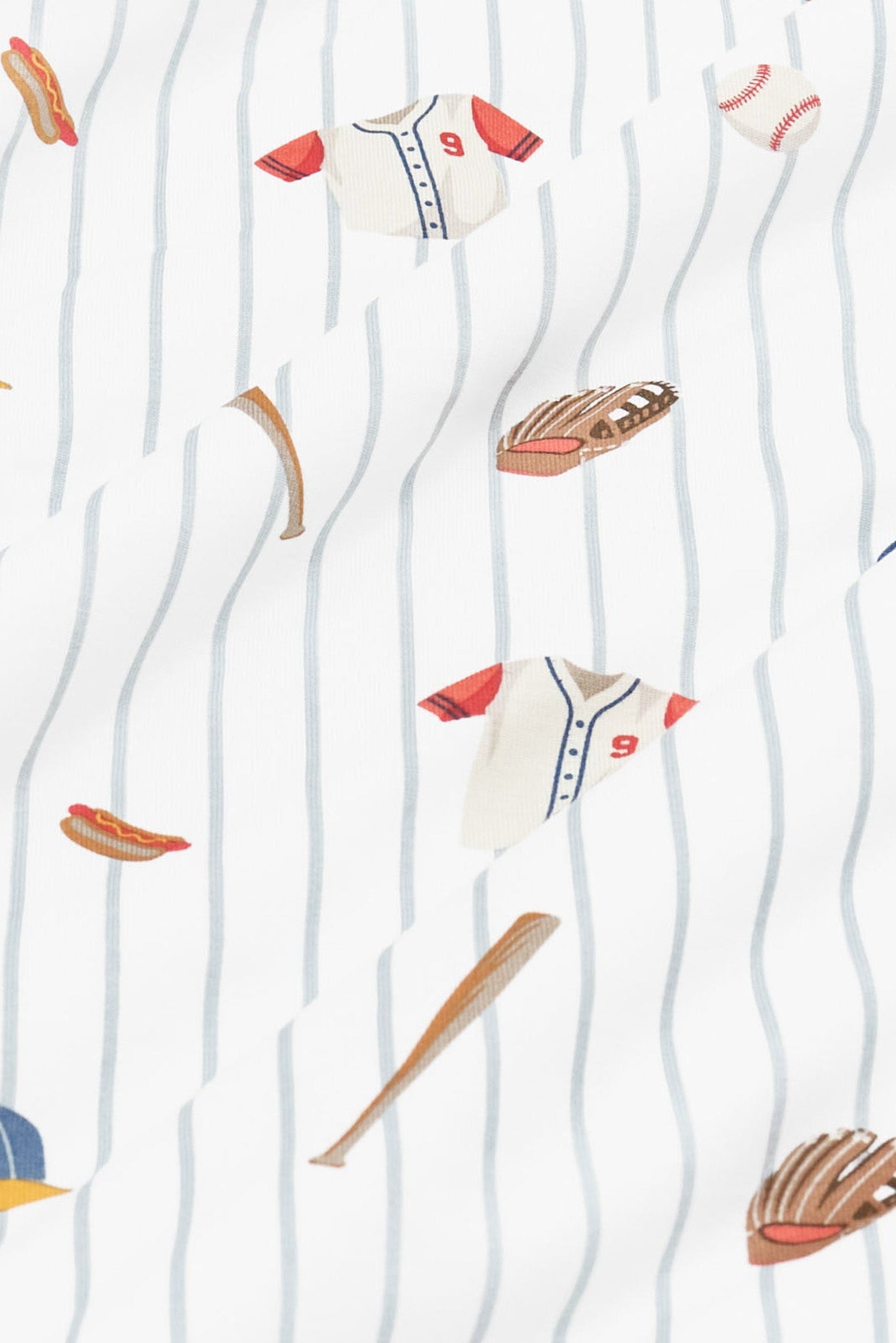 Close up of fabric showing the baseball print