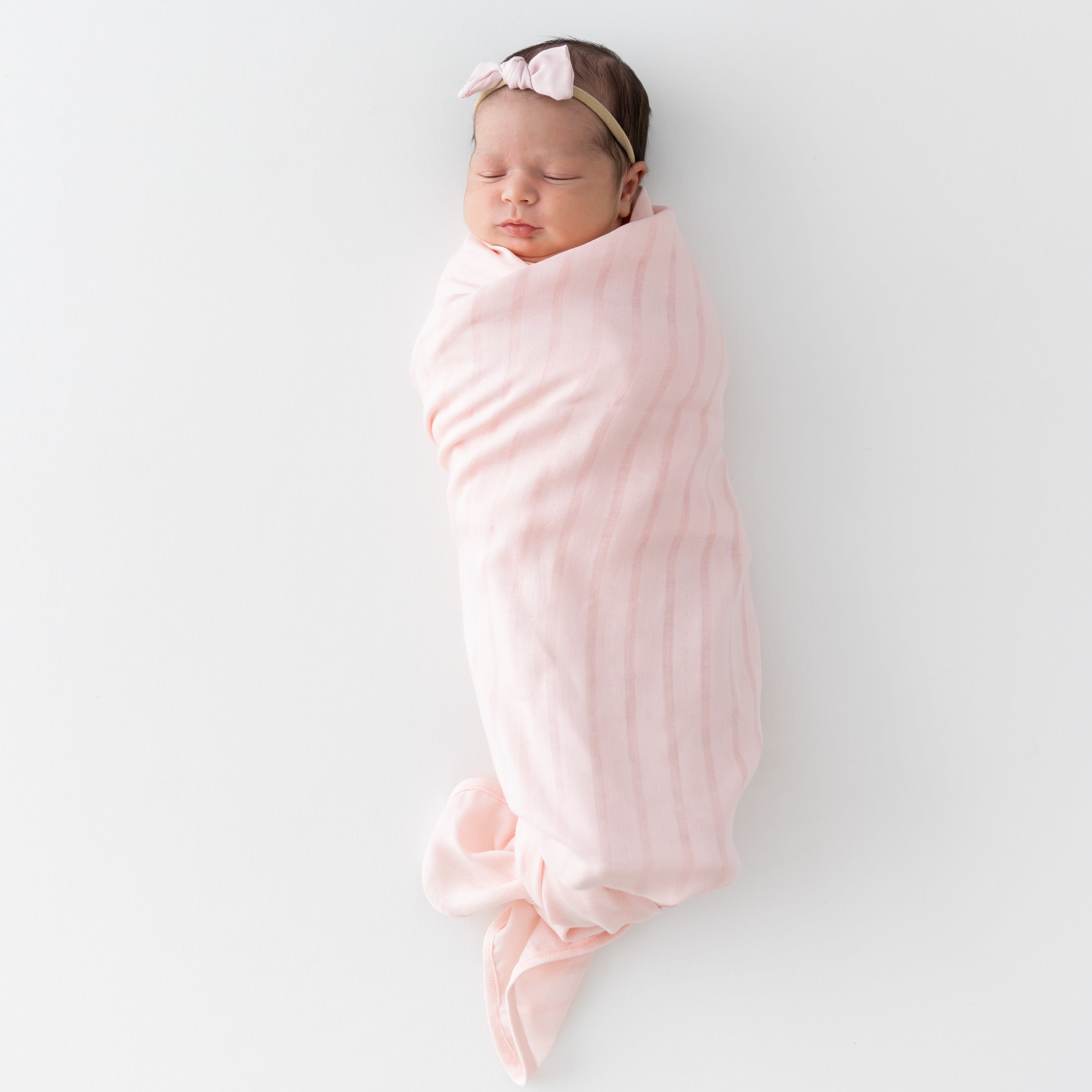 Baby Swaddled in Pink Bamboo Muslin Swaddling Blanket in Ballet