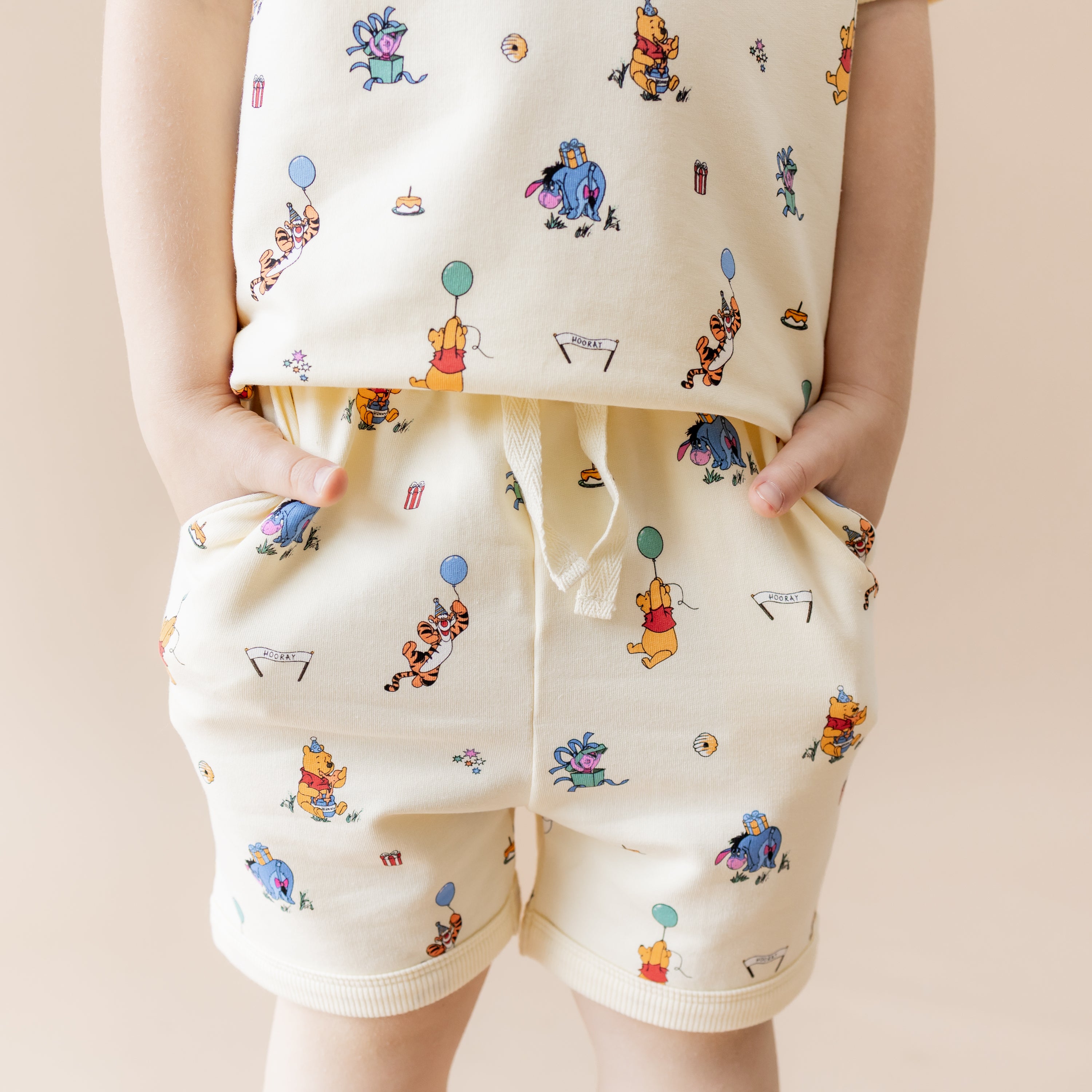 Close up of the shorts on the Short Sleeve Jogger Set in Winnie the Pooh Celebration