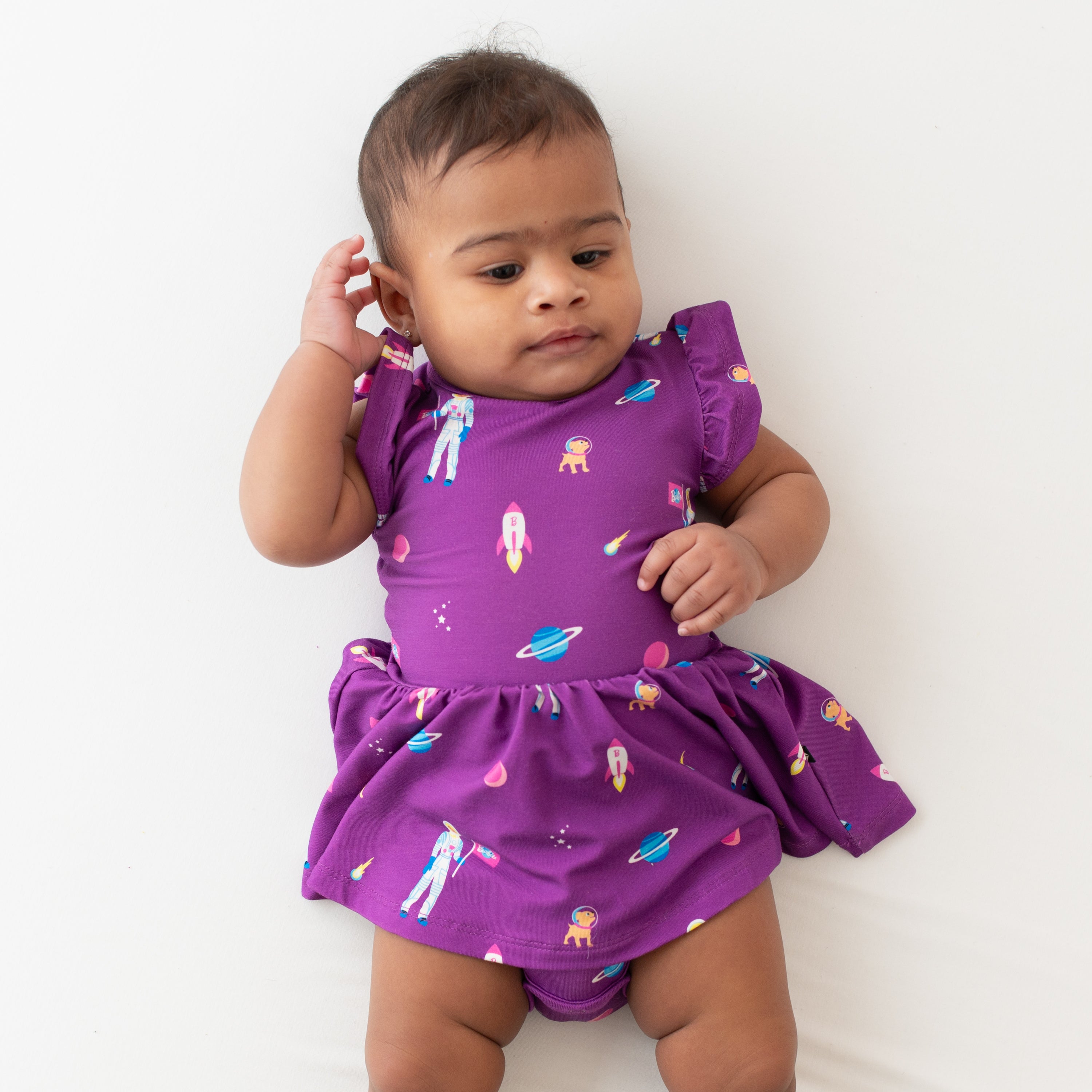 Baby wearing bamboo purple Twirl Bodysuit Dress in Barbie™ Astronaut