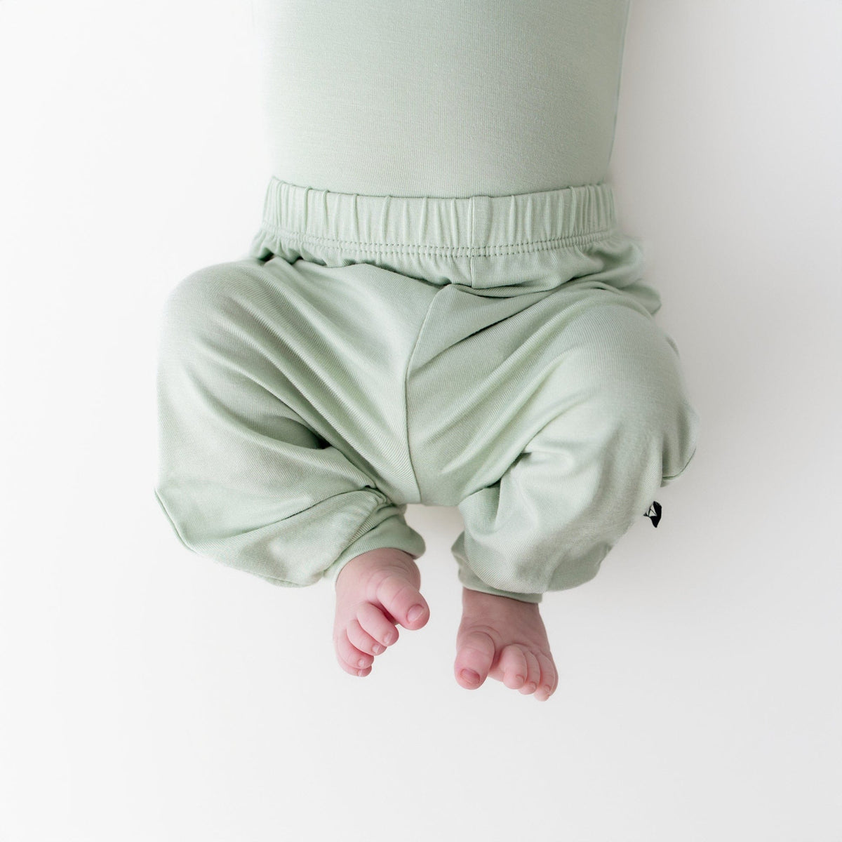 close up of the Pant in Basil on a newborn