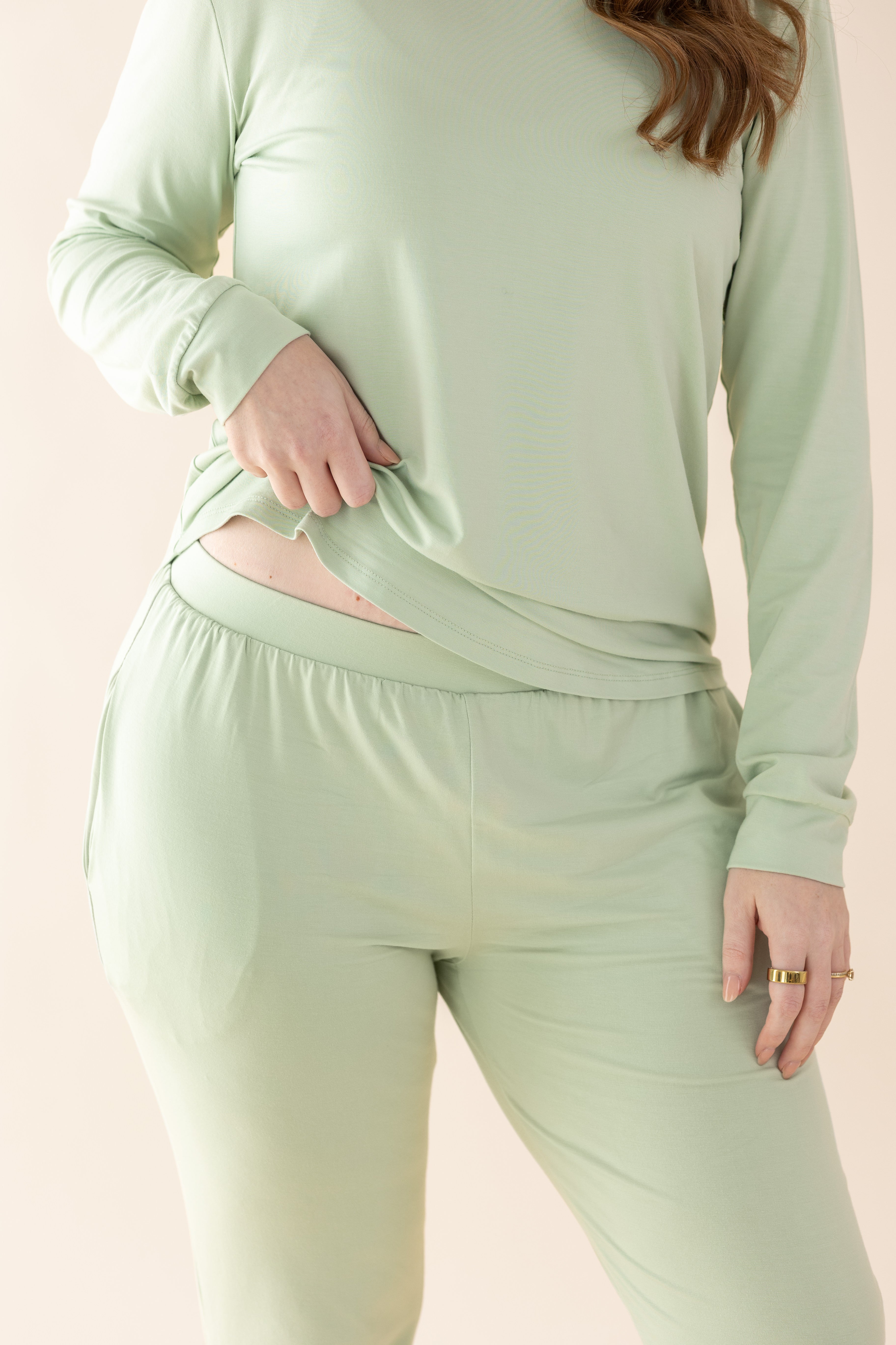 Smooth elastic waistband on the pants of the Women's Jogger Pajama Set in Basil shown on a female model
