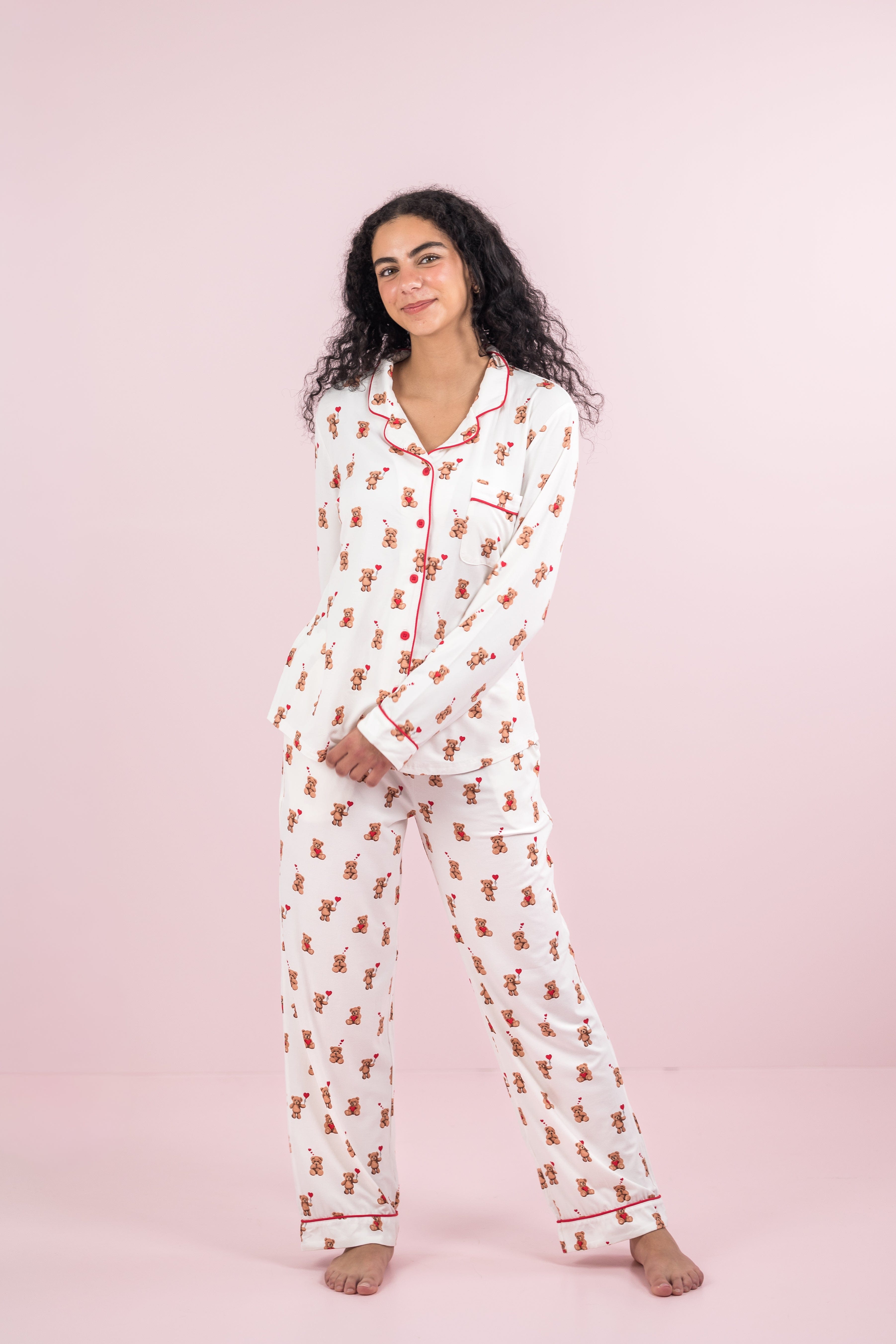 Female model posing wearing the Long-Sleeved Women's Pajama Set in Bear Hearts