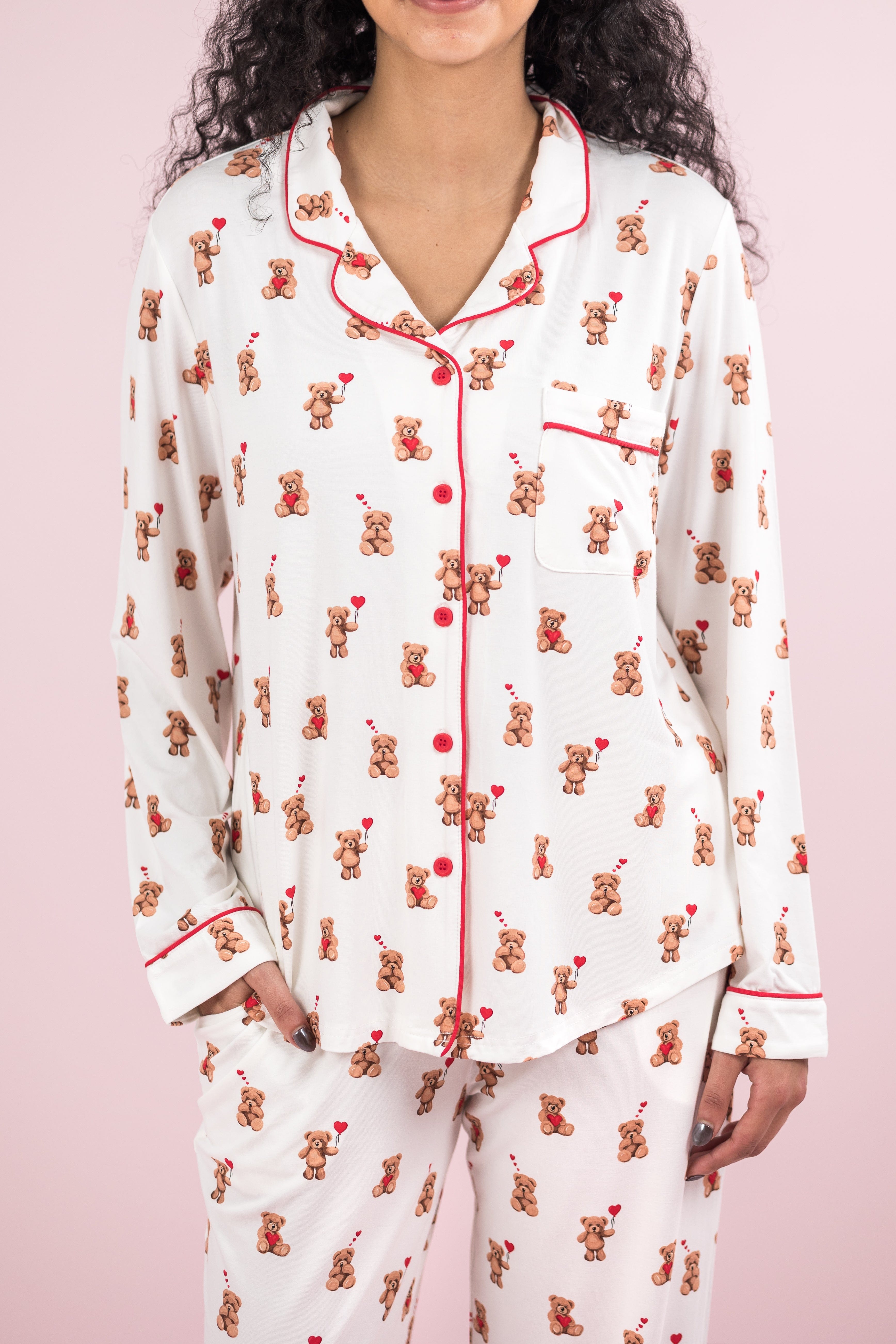 Close up of the button closures and red trim on the shirt of the Long-Sleeved Women's Pajama Set in Bear Hearts