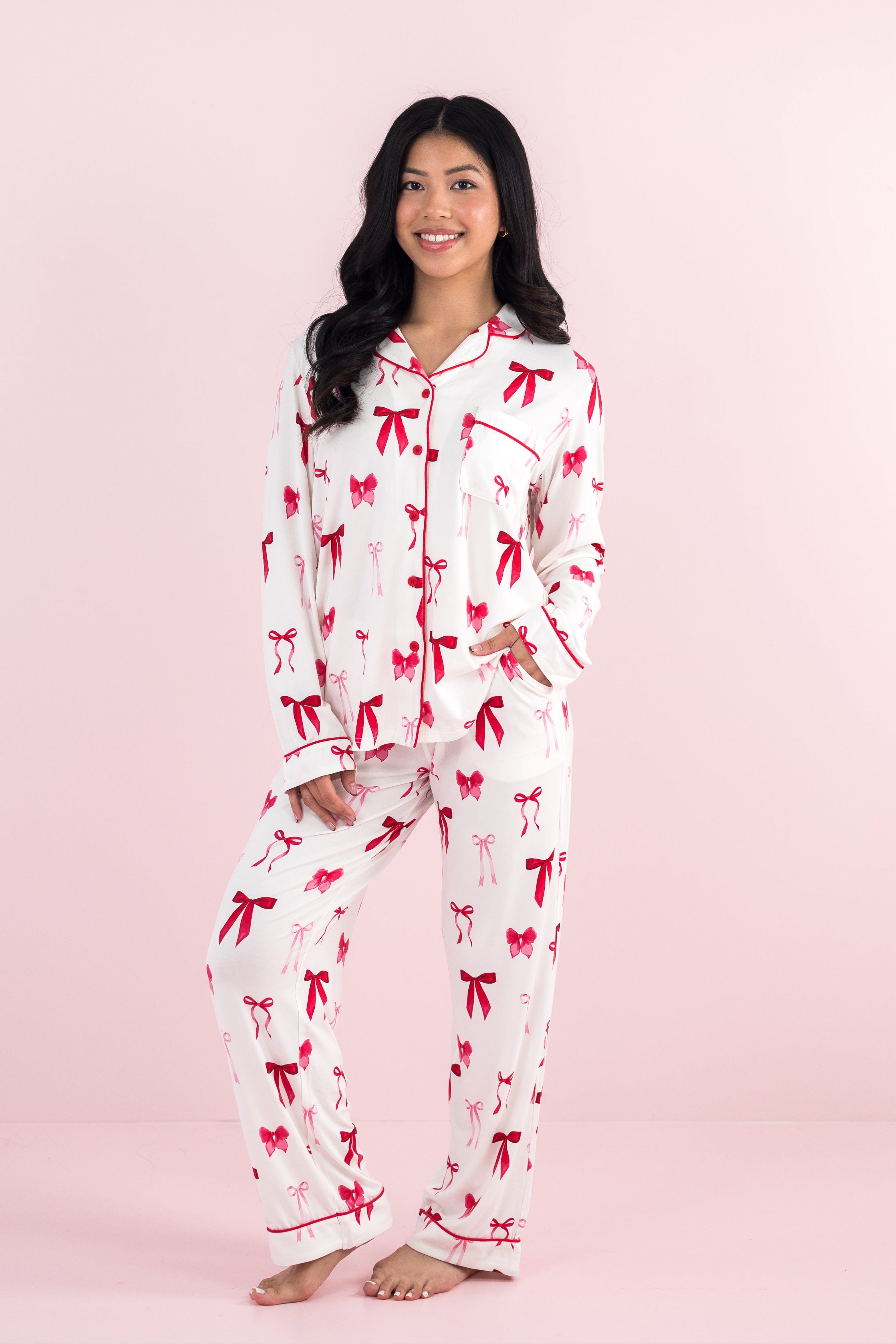 Smiling model wearing the Bamboo Long-Sleeved Women's Pajama Set in Big Love Bow