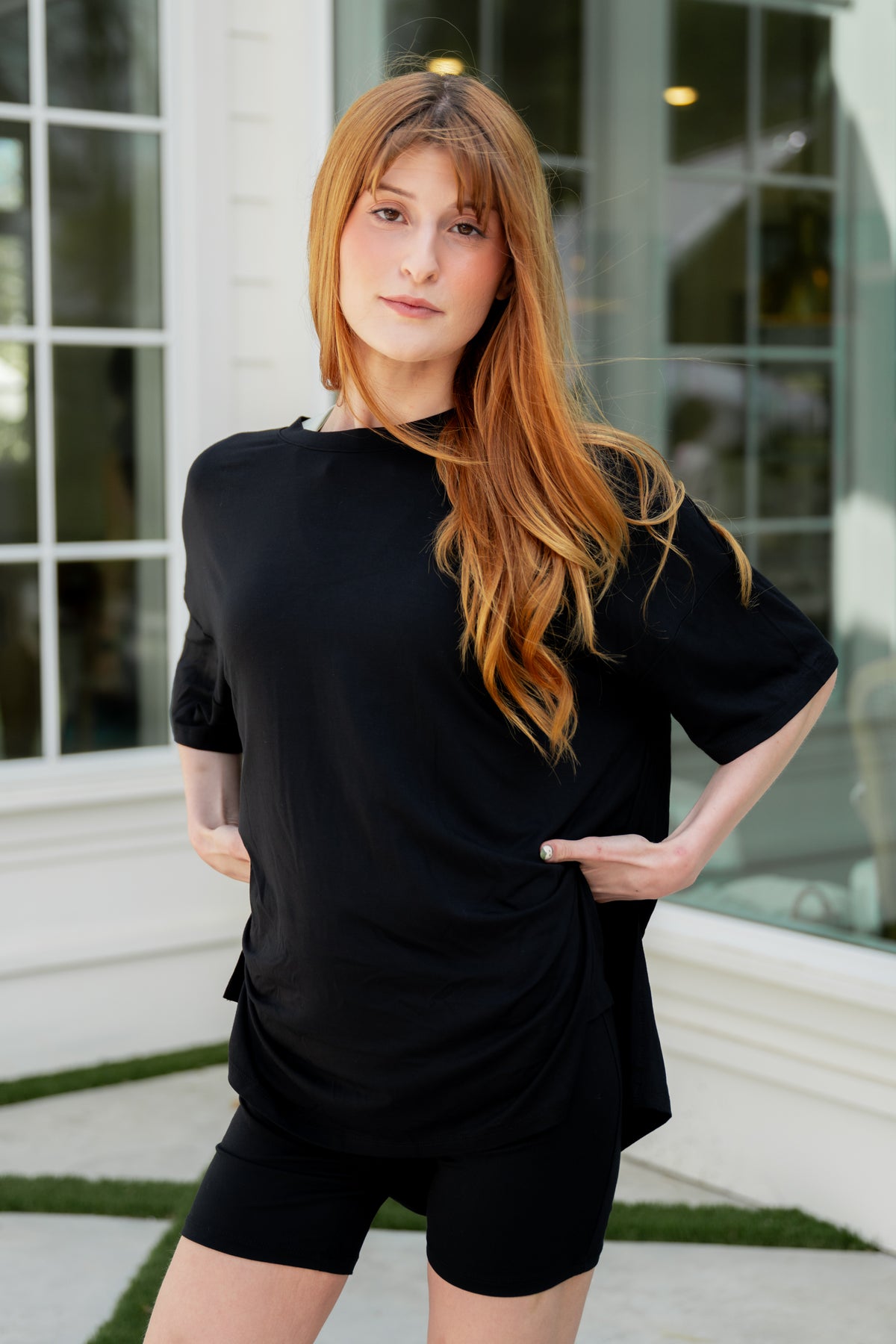 Female modeling the Women’s Biker Short Set in Midnight with her hands on her hips