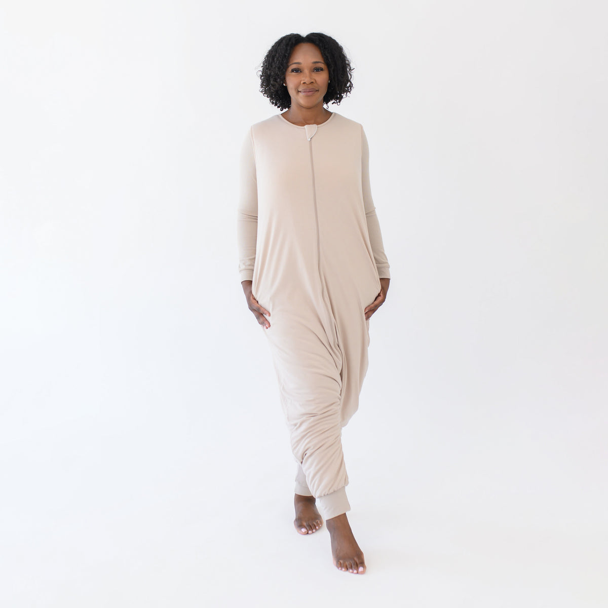 Female standing wearing the Adult Sleep Bag Walker in Bisque