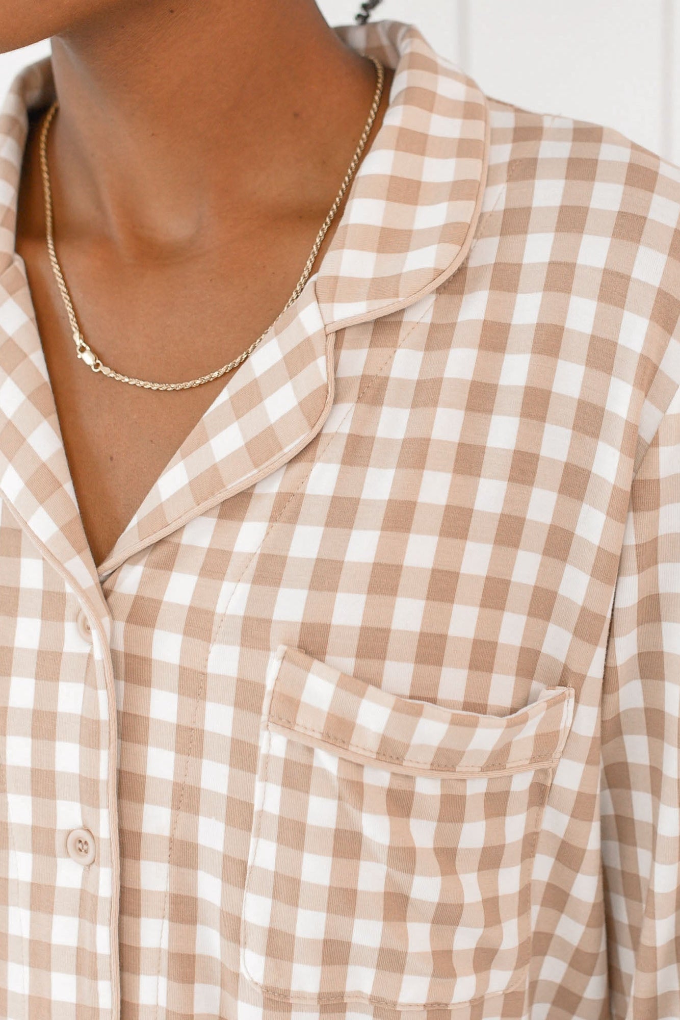 Close up of the chest pocket detail on the Top of the Long-Sleeved Women's Pajama Set in Gingham Bisque