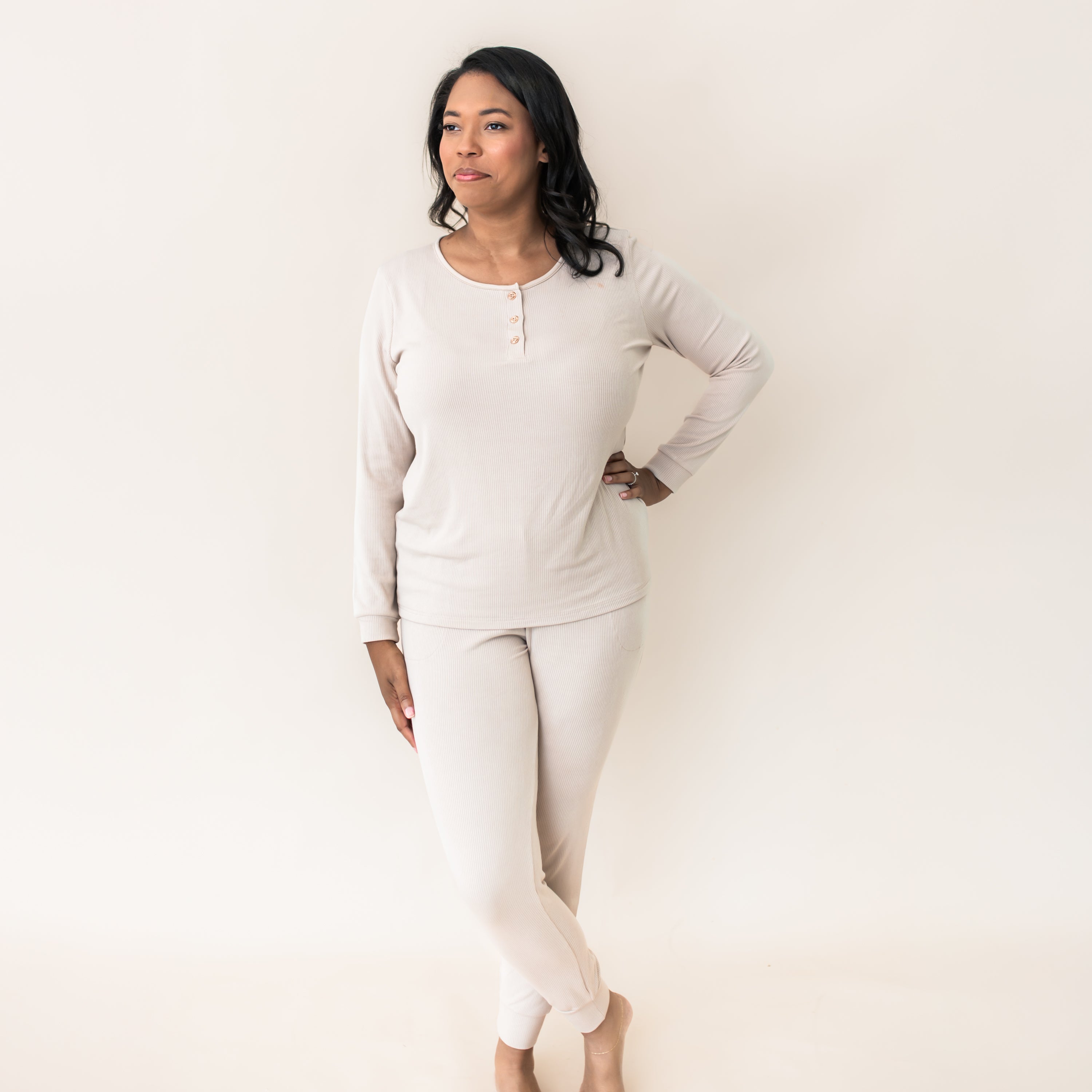 Female standing with one hand on hip wearing the Women’s Ribbed Henley Set in Bisque