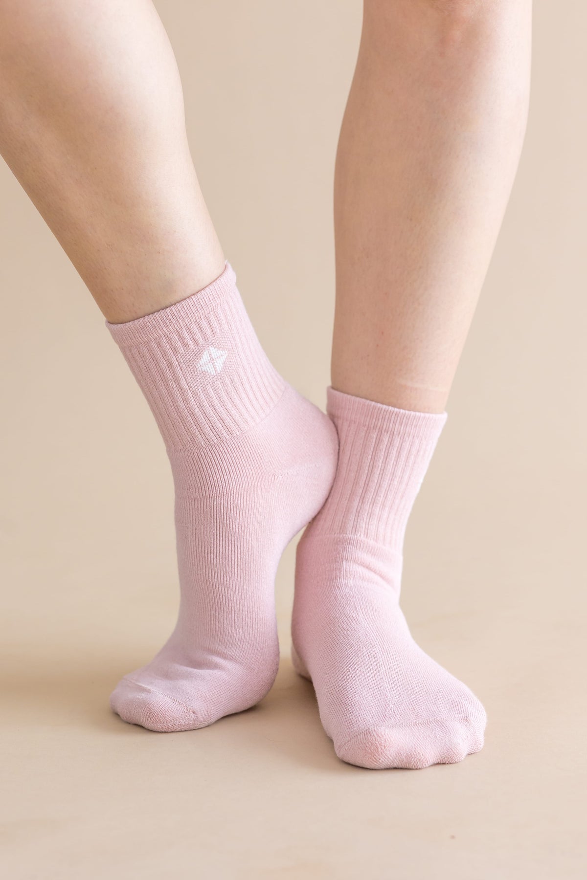 Adult Crew Socks in Blush shown on the feet of a model
