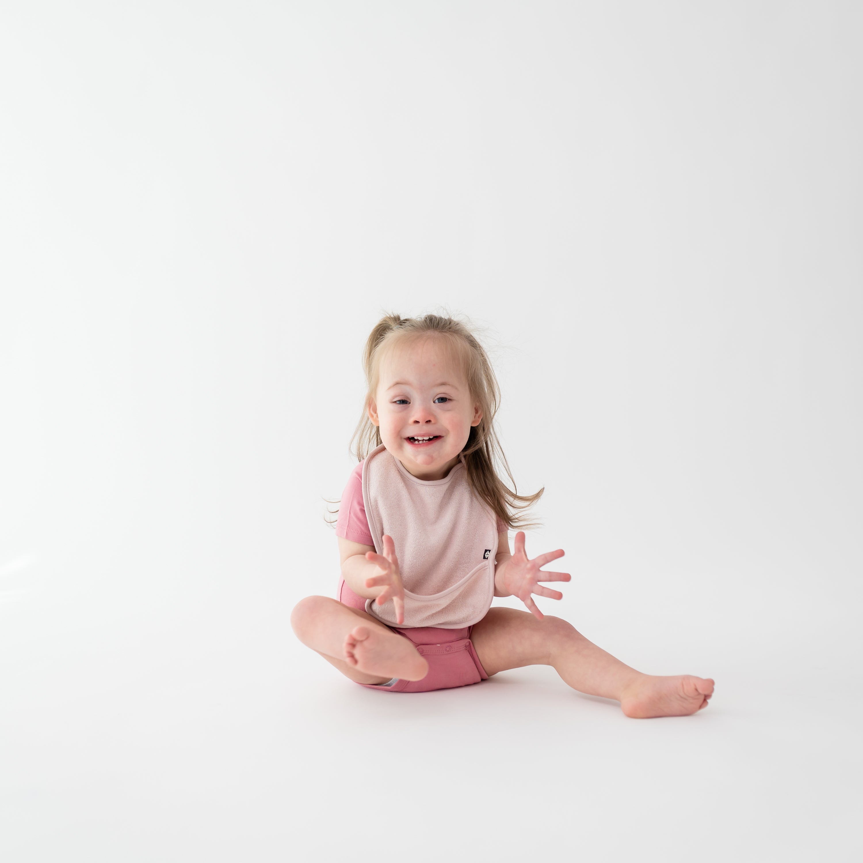 Toddler wearing Blush Pink Terry Pocket Bib