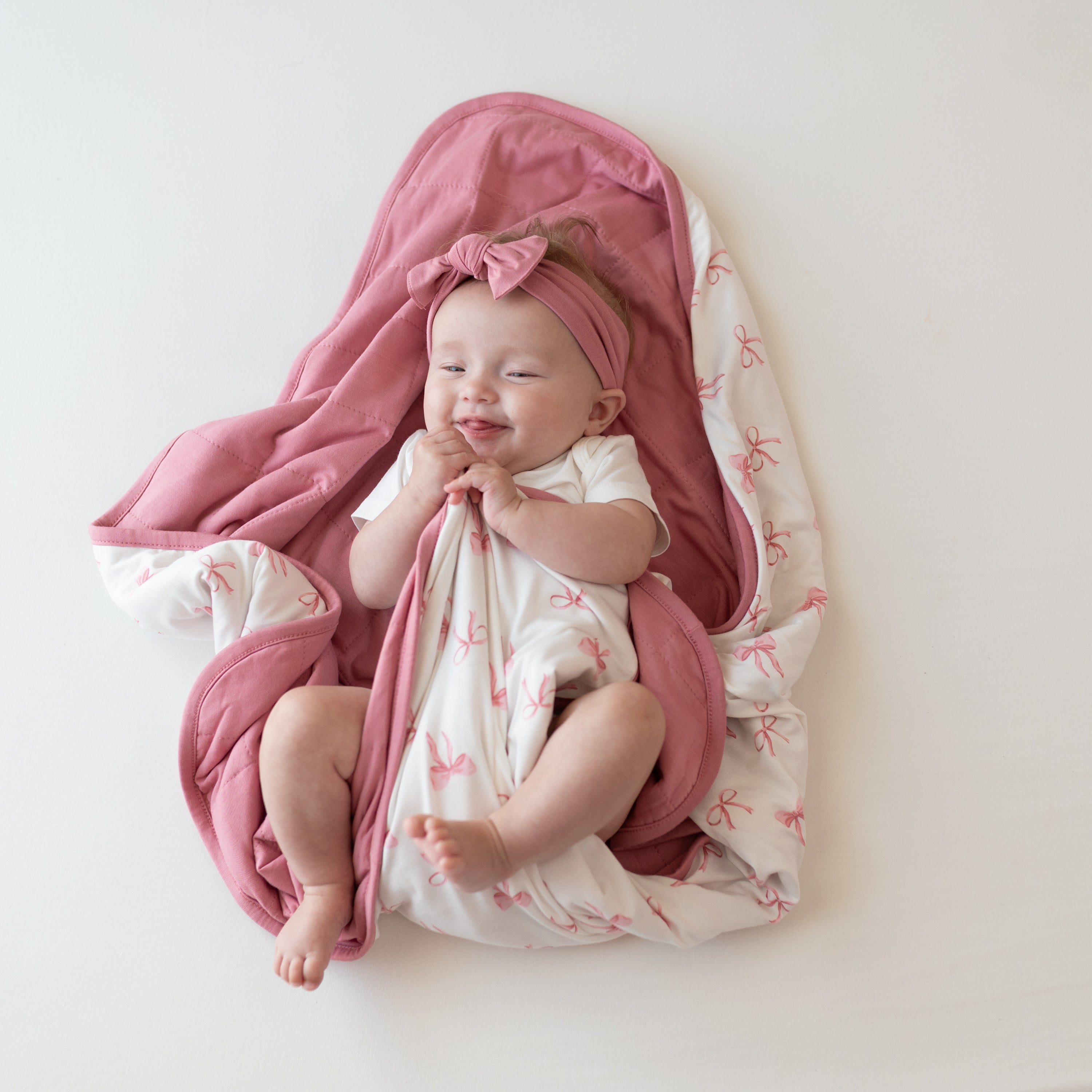 Baby wrapped in Baby Blanket in Bow 1.0 TOG