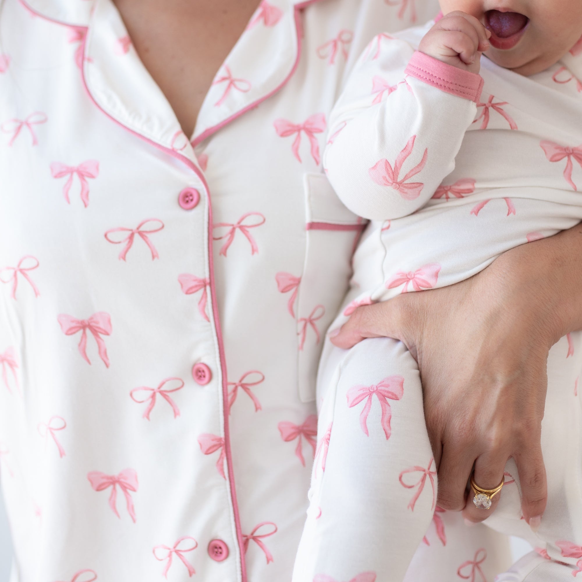 Mom and baby wearing matching mother daughter pajamas in Bow